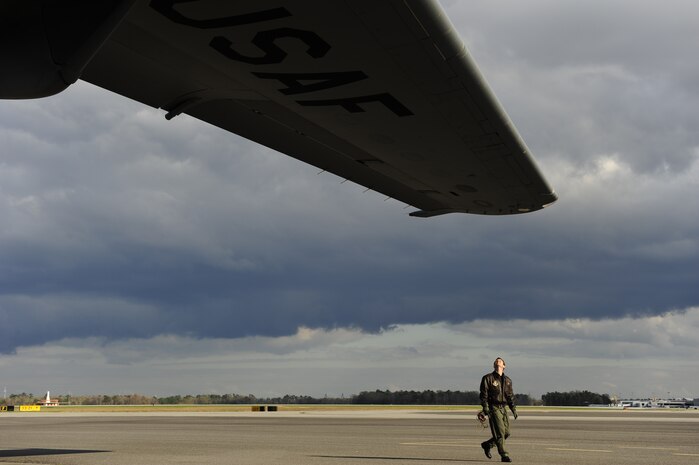 U.S. Air Force Maj. Michael Desantis, a pilot with the 317th Airlift Squadron, performs a pre-flight inspection on a C-17 Globemaster III to identify any discrepancies before taking off from Joint Base Charleston, S.C., for a night proficiency mission March 22, 2010. Night proficiency missions are conducted to ensure compliance with Air Force training requirements, which in return enhances a pilot's readiness to operate their aircraft at a moment's notice, day or night. (U.S. Air Force photo/Staff Sgt. Joshua L. DeMotts)