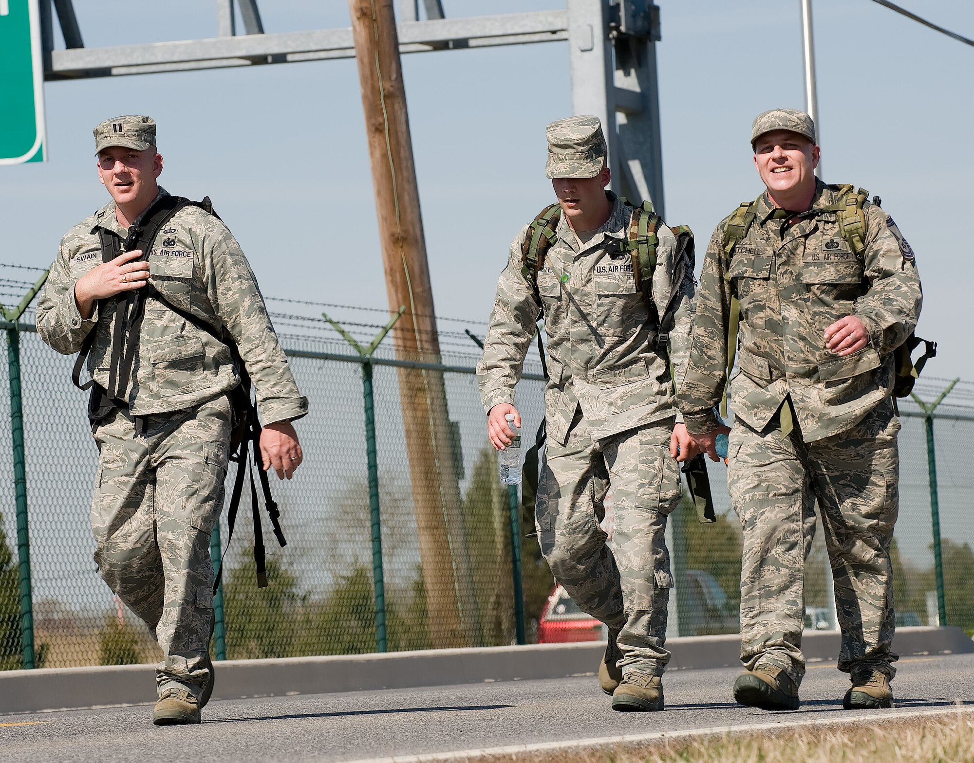 Capt. Gordon Swain (from left), Air Force Mortuary Affairs Operations Center Dignified Transfer officer in charge, Senior Airman Jason Saulter, AFMAO Dignified Transfer team member, and Senior Master Sgt. Richard Mitchell, Uniforms section chief, participate in the 436th Security Forces Squadron's 11th Annual Ruck March held March 20. The annual 6.2 mile march is a fundraiser to honor the veterans of the Korean War who fought in the Battle of the Chosin Reservoir. (U.S. Air Force photo/Jason Minto)