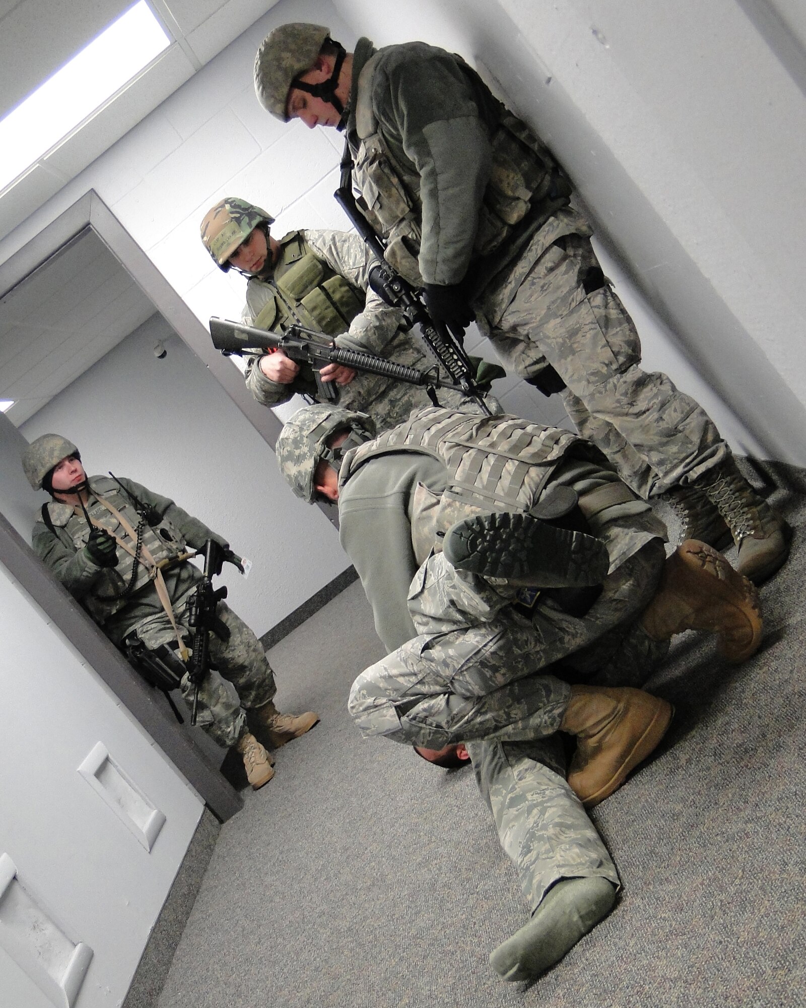 The 354th Security Forces first repsonders apprehend a suspect during a simulated active shooter scenario during Exercise Golden Raven 10-2 March 22, 2010, Eielson Air Force Base, Alaska. The active shooter exercise is one of the many ways Airmen are tested on their operational readiness. (U.S. Air Force photo/Tech. Sgt. John Gott)