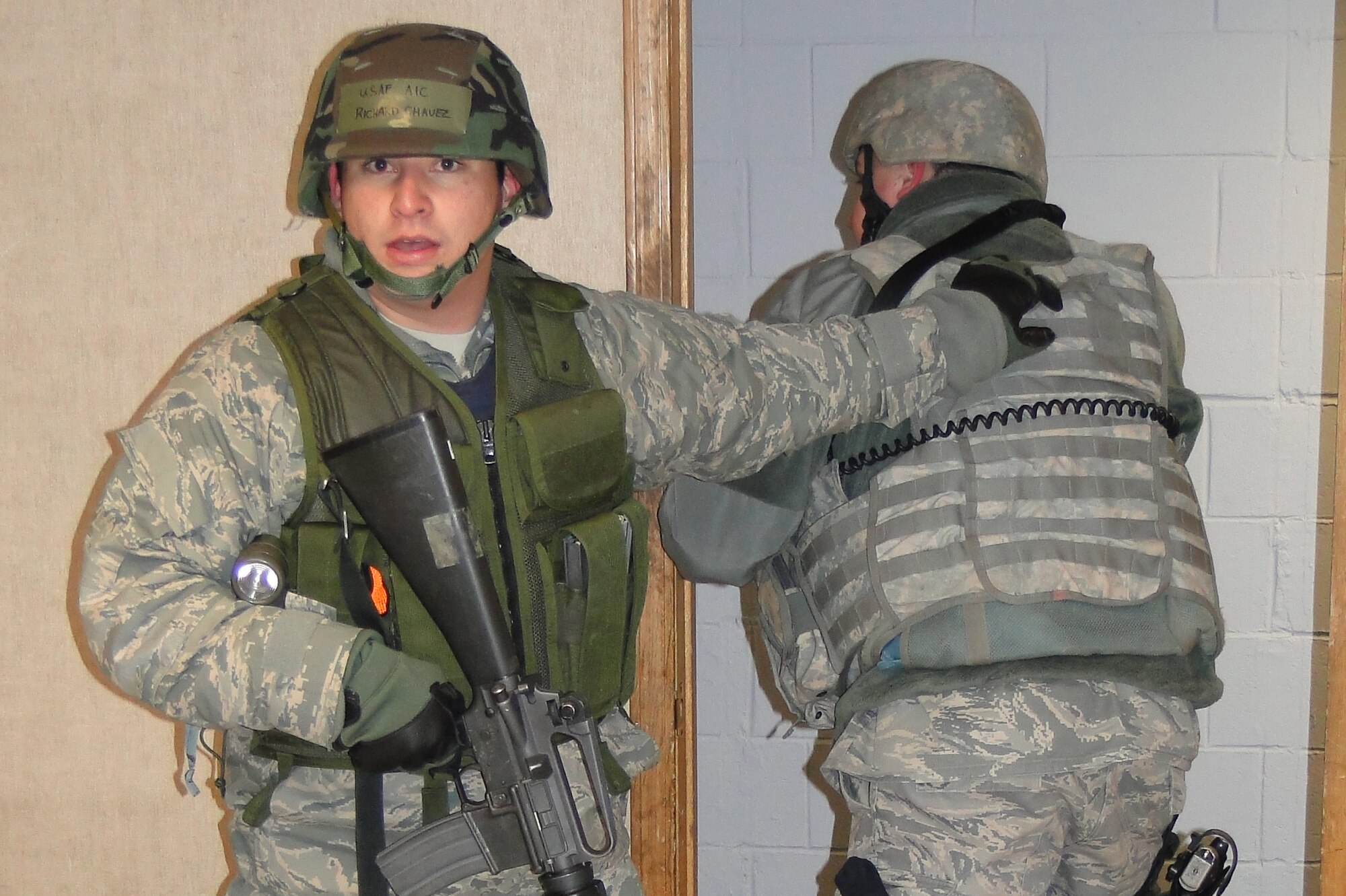 Airman First Class Richard Chavez assists in clearing the basement of Amber Hall during an active shooter scenario that was part of Operation Golden Raven 10-2, March 22, 2010, Eielson Air Force Base.  Airman Chavez is a Security Forces augmentee assigned to the 18th Agressor Squadron. (U.S. Air Force photo/Tech. Sgt. John Gott)