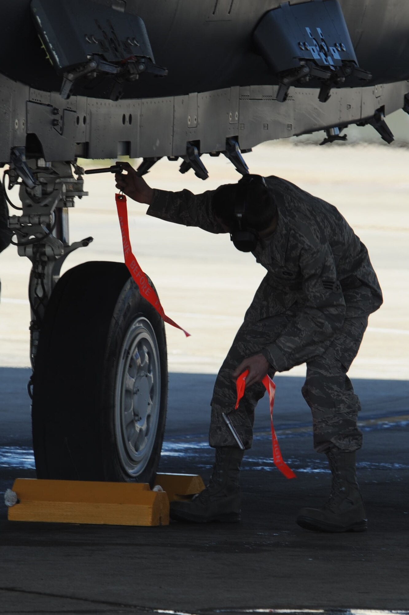 Senior Airman Bobby Kerr, 307th Fighter Squadron reservist crew chief, inserts safety pins into a F-15E Strike Eagle after a flight on Seymour Johnson Air Force Base, N.C., March 19, 2010. The 307th Fighter Squadron falls under the 414th Fighter Group, a new unit standing-up on Seymour Johnson AFB to support the growing F-15E Strike Eagle mission. Kerr hails from Boone, N.C. (U.S.  Air Force photo/Senior Airman Whitney Lambert)