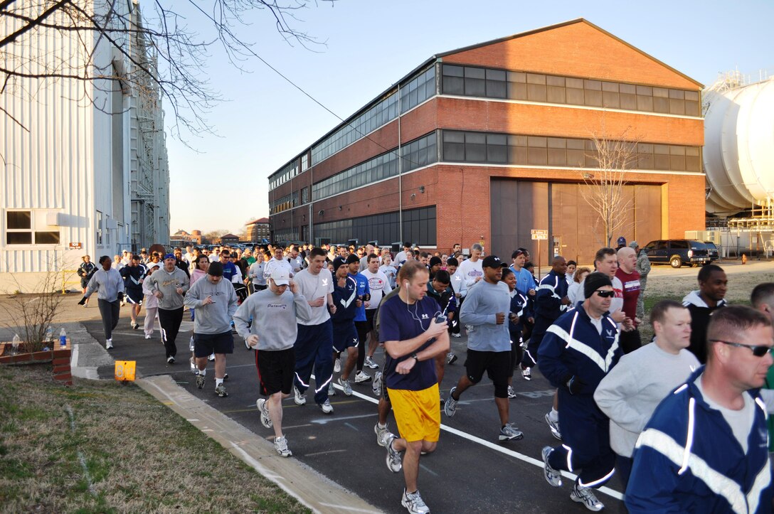 LANGLEY AIR FORCE BASE, Va. -- More than 200 Airmen and families dash off the line at the start of the 633d Force Support Squadron St. Patrick's Day 5K and 10K run, walk, March 19. The race participants began at the edge of the Lighter-Than-Air flight line running trail and circled back to the Air Combat Command Fitness Center for bananas and water. (Photo courtesy of 633d Force Support Squadron)