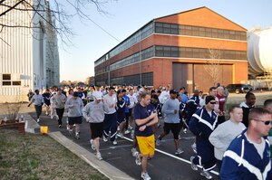 LANGLEY AIR FORCE BASE, Va. -- More than 200 Airmen and families dash off the line at the start of the 633d Force Support Squadron St. Patrick's Day 5K and 10K run, walk, March 19. The race participants began at the edge of the Lighter-Than-Air flight line running trail and circled back to the Air Combat Command Fitness Center for bananas and water. (Photo courtesy of 633d Force Support Squadron)