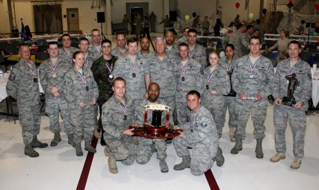 LANGLEY AIR FORCE BASE, Va. -- Winners display their awards at the 2010 1st and 192D Fighter Wings' Maintenance Professional of the Year Awards Banquet March 13. The ceremony honored exceptional performers in the maintenance field in 14 categories. (Courtesy photo)