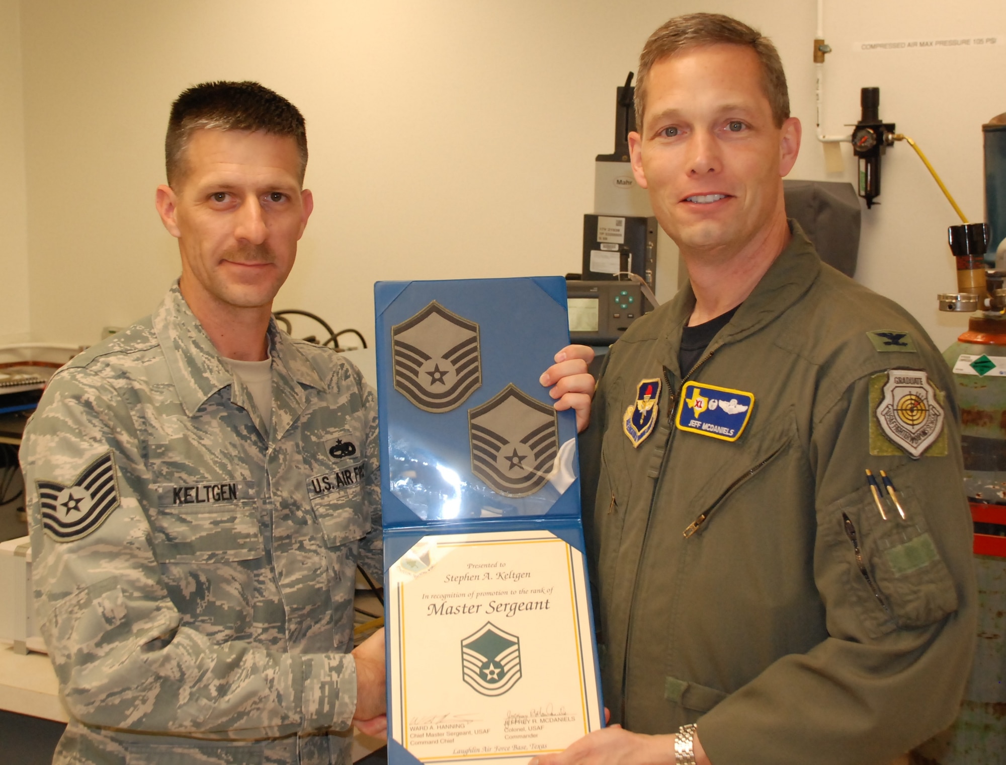 LAUGHLIN AIR FORCE BASE, Texas – Master Sgt. Stephen Keltgen, 47th Maintenance Directorate, poses with Col. Jeffrey McDaniels, 47th Flying Training Wing commander, after being promoted to the rank of master sergeant through the Air Force’s Stripes for Exceptional Performers program March 17. Sergeant Keltgen was one of only two individuals from throughout Air Education and Training Command that will be promoted to master sergeant through this program this year. (U.S. Air Force photo by Airman 1st Class Blake Mize)