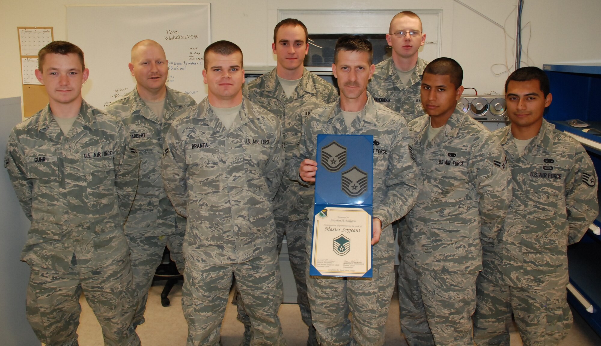 LAUGHLIN AIR FORCE BASE, Texas – Master Sgt. Stephen Keltgen, 47th Maintenance Directorate, poses with fellow members of his squadron after being promoted to the rank of master sergeant through the Air Force’s Stripes for Exceptional Performers program March 17. Sergeant Keltgen was one of only two individuals from throughout Air Education and Training Command that will be promoted to master sergeant through this program this year. (U.S. Air Force photo by Airman 1st Class Blake Mize)