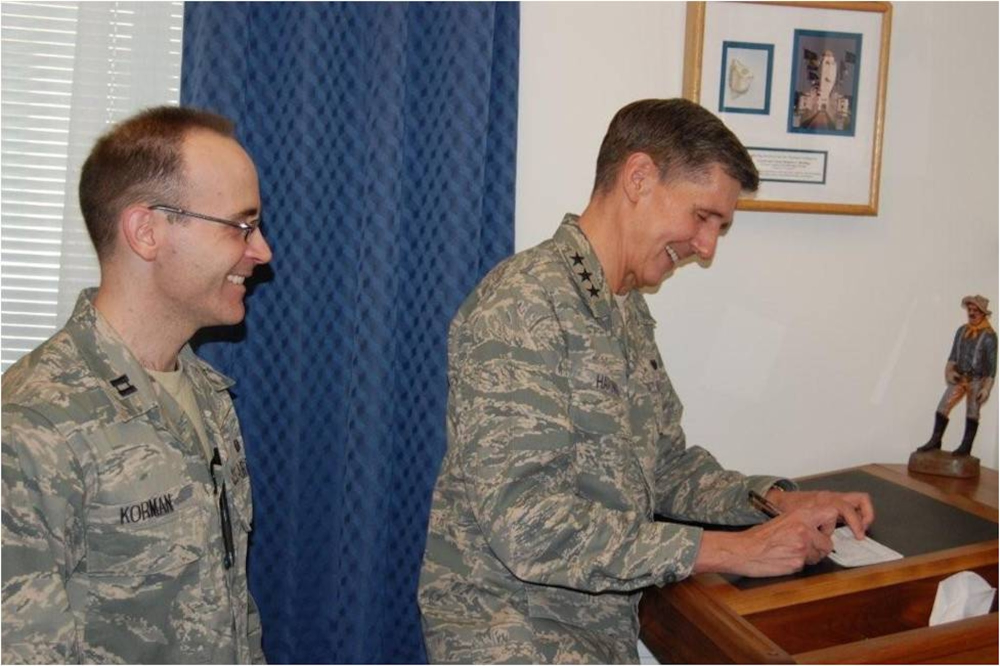 The Judge Advocate General, Lt Gen Richard C. Harding, makes a donation to the Air Force Assistance Fund.