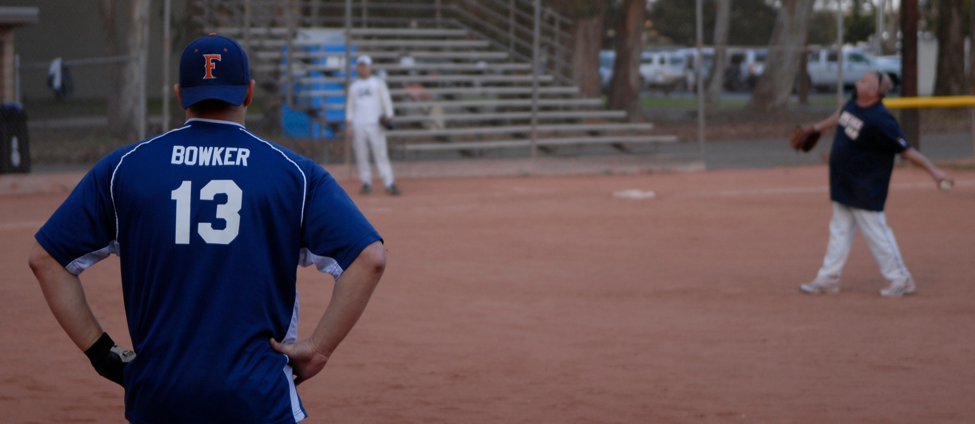 VANDENBERG AIR FORCE BASE, Calif. -- Christopher Bowker, a 381st Training Group team member, waits on first base during the base intramural softball championship Friday, March 19, 2010, in the field behind the old fitness center here.  The Army Prison Guard intramural softball team played a doubleheader against the 381st Training Group team, winning 12-9 and taking the championship game 12-2.  (U.S. Air Force photo/Senior Airman Andrew Satran) 

 

 

 

 