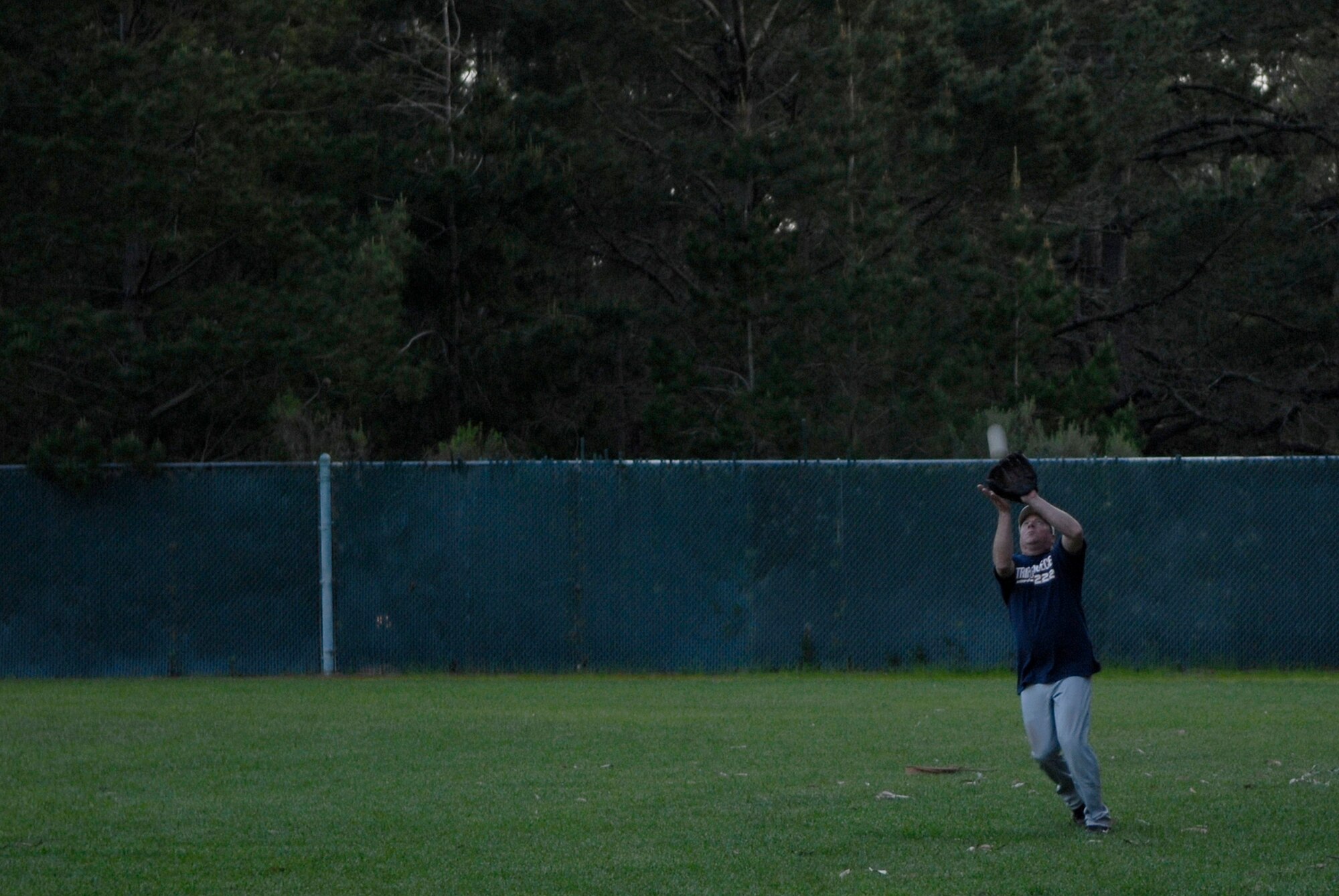 VANDENBERG AIR FORCE BASE, Calif. -- Catching a fly ball, Scott Abrahims, an Army Prison Guard team member,  helps make the final out against the 381st Training Group team during the base intramural softball championship Friday, March 19, 2010, in the field behind the old fitness center here.  The Army Prison Guard intramural softball team played a doubleheader against the 381st Training Group team, winning 12-9 and taking the championship game 12-2.  (U.S. Air Force photo/Senior Airman Andrew Satran) 

 

 

 