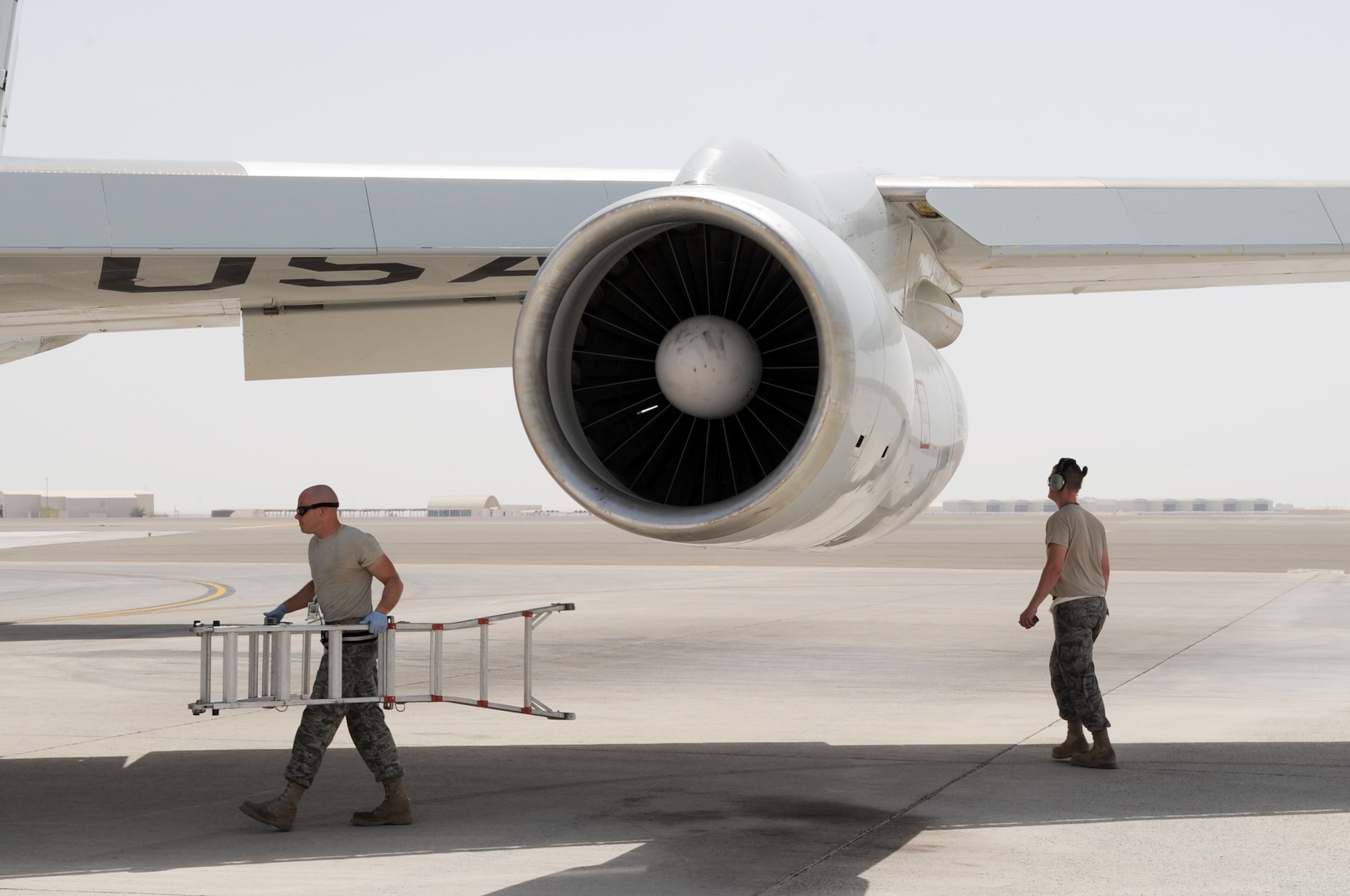 Airmen assigned to the 380th Expeditionary Aircraft Maintenance Squadron's Sentry aircraft maintenance unit recover an E-3 Sentry Airborne Warning and Control System, or AWACS, aircraft on the flightline of a non-disclosed base in Southwest Asia on March 23, 2010. The action comes 33 years to the day when the Air Force received its first E-3 Sentry into its inventory on March 23, 1977. This E-3, assigned to the 965th Expeditionary Airborne Air Control Squadron, along with the maintenance Airmen are deployed to Southwest Asia from the 552nd Air Control Wing at Tinker Air Force Base, Okla. (U.S. Air Force Photo/Master Sgt. Scott T. Sturkol/Released)