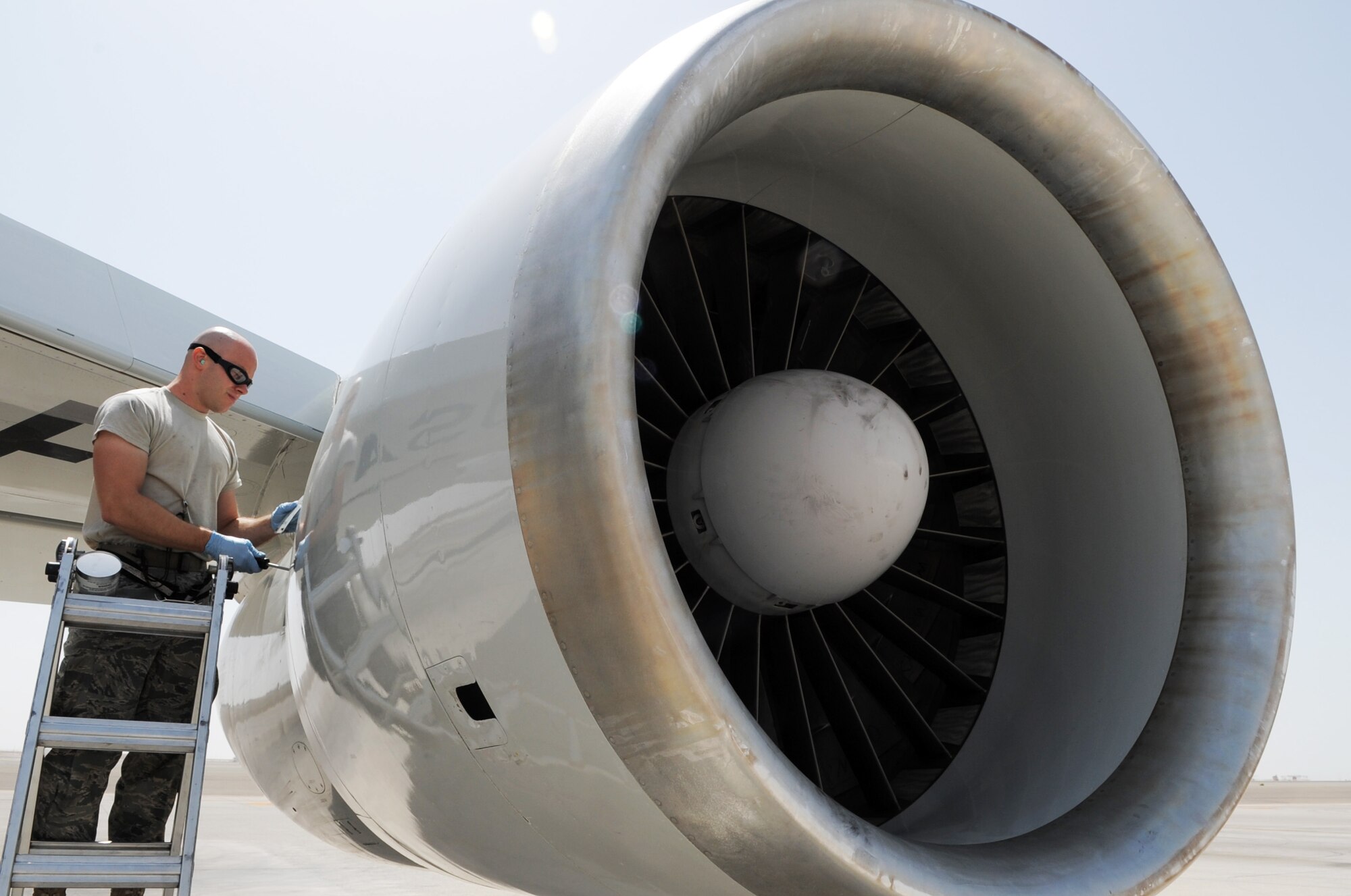 Staff Sgt. Joshua Gotbaum, E-3 Sentry aerospace propulsion technician with the 380th Expeditionary Aircraft Maintenance Squadron Sentry aircraft maintenance unit, checks the engine of an E-3 during operations on the flightline for the 380th Air Expeditionary Wing at a non-disclosed base in Southwest Asia on March 23, 2010.  Sergeant Gotbaum is deployed from the 552nd Aircraft Maintenance Squadron at Tinker Air Force Base, Okla., and his hometown is Miami, Fla. (U.S. Air Force Photo/Master Sgt. Scott T. Sturkol/Released)