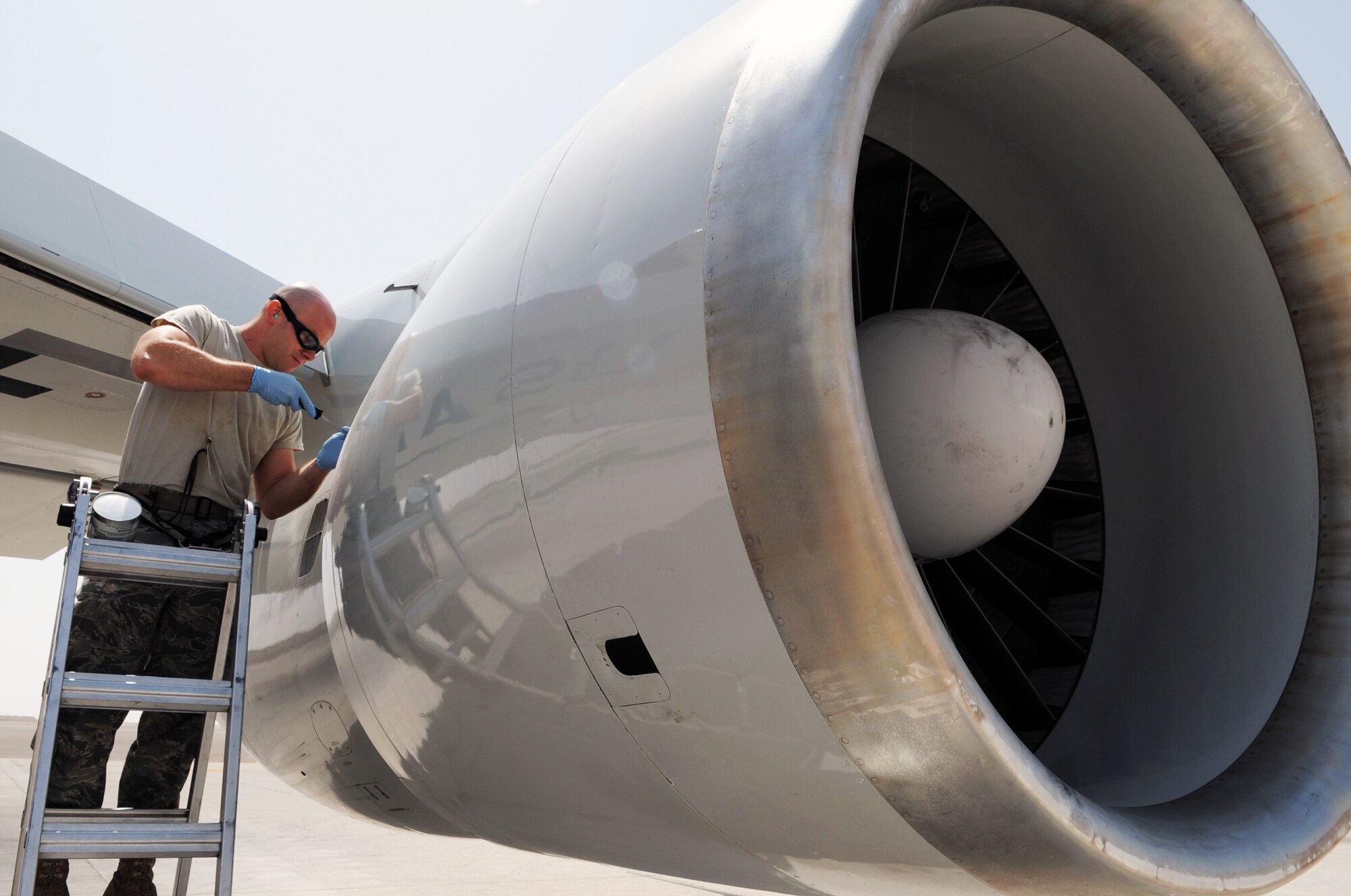 Staff Sgt. Joshua Gotbaum, E-3 Sentry aerospace propulsion technician with the 380th Expeditionary Aircraft Maintenance Squadron Sentry aircraft maintenance unit, checks the engine of an E-3 during operations on the flightline for the 380th Air Expeditionary Wing at a non-disclosed base in Southwest Asia on March 23, 2010.  Sergeant Gotbaum is deployed from the 552nd Aircraft Maintenance Squadron at Tinker Air Force Base, Okla., and his hometown is Miami, Fla. (U.S. Air Force Photo/Master Sgt. Scott T. Sturkol/Released)