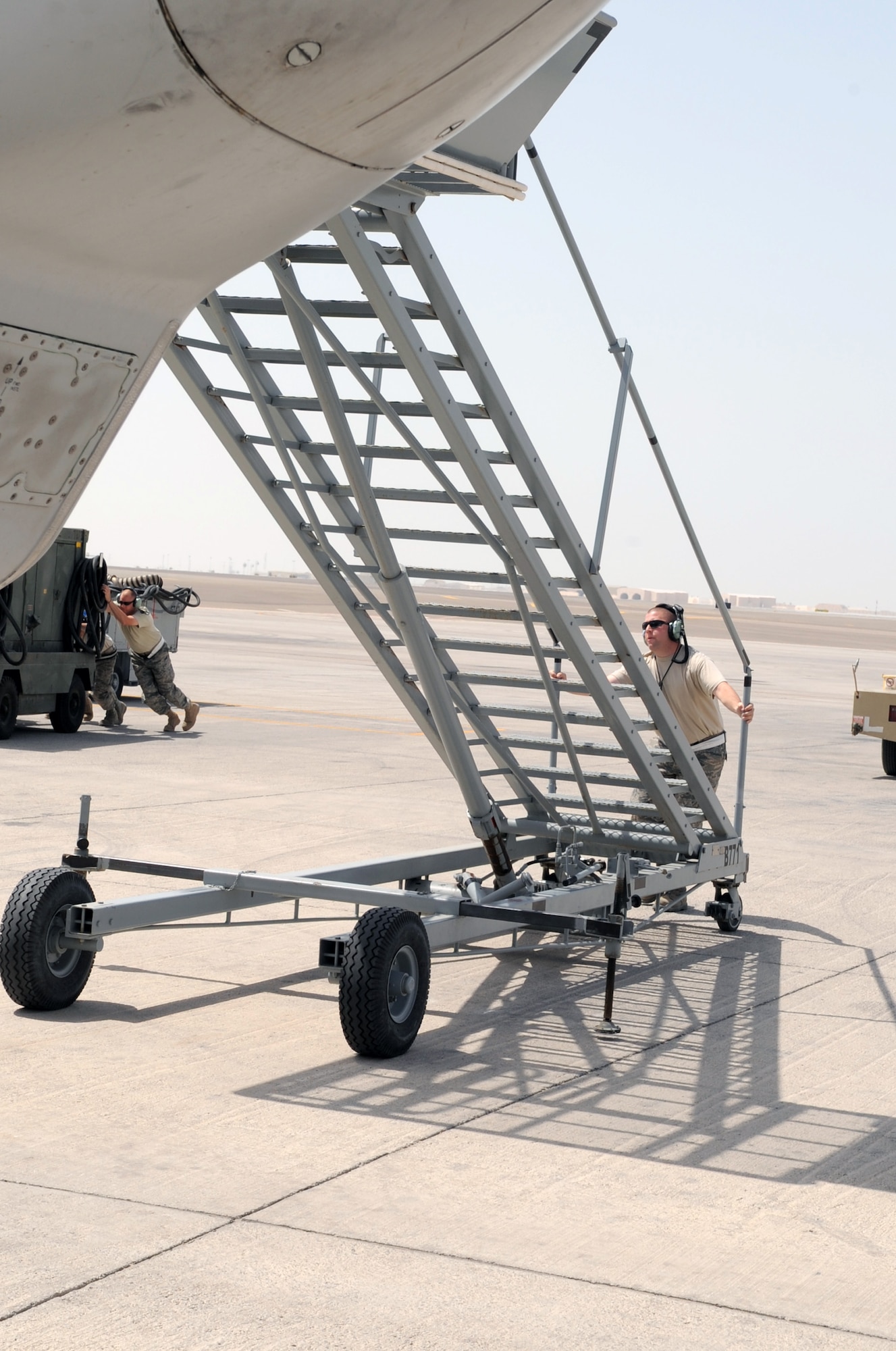 Airmen assigned to the 380th Expeditionary Aircraft Maintenance Squadron's Sentry aircraft maintenance unit recover an E-3 Sentry Airborne Warning and Control System, or AWACS, aircraft on the flightline of a non-disclosed base in Southwest Asia on March 23, 2010. The action comes 33 years to the day when the Air Force received its first E-3 Sentry into its inventory on March 23, 1977. This E-3, assigned to the 965th Expeditionary Airborne Air Control Squadron, along with the maintenance Airmen are deployed to Southwest Asia from the 552nd Air Control Wing at Tinker Air Force Base, Okla. (U.S. Air Force Photo/Master Sgt. Scott T. Sturkol/Released)