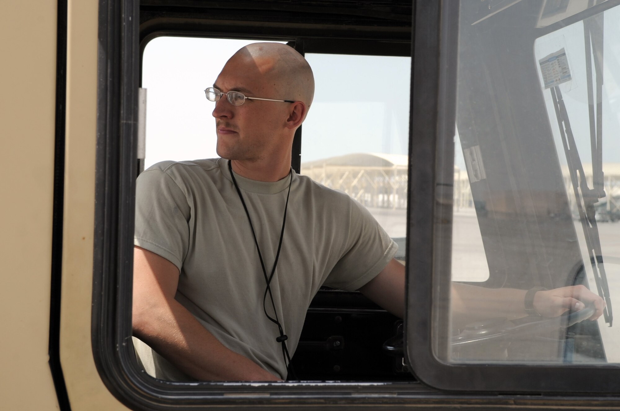 Senior Airman John Mason, E-3 Sentry crew chief with the 380th Expeditionary Aircraft Maintenance Squadron Sentry aircraft maintenance unit, drives a "tug" while moving an E-3 into a parking space on the flightline during operations on the flightline for the 380th Air Expeditionary Wing at a non-disclosed base in Southwest Asia on March 23, 2010.  Airman Mason is deployed from the 552nd Aircraft Maintenance Squadron at Tinker Air Force Base, Okla., and his hometown is Lexington, Ky. (U.S. Air Force Photo/Master Sgt. Scott T. Sturkol/Released)