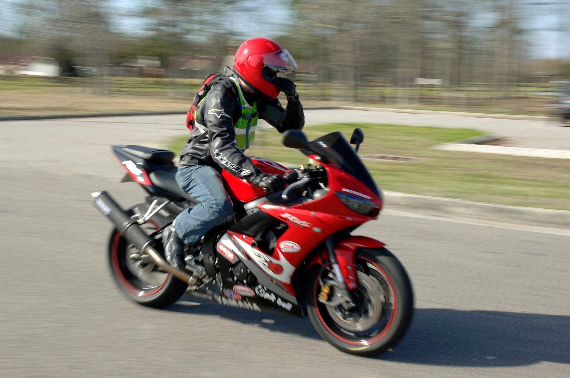 A member of Joint Base Charleston takes off from the base theater after attending an annual mandatory motorcycle riding briefing, which kicked off Air Mobility Command?s Spring Safety Focus March 19, 2010. More than 200 motorcycle riders from Joint Base Charleston showed up for the mandatory briefing and had the opportunity to participate in a Motorcycle Mentoring ride to Naval Weapons Station Short Stay. (U.S. Air Force photo/Staff Sgt. Marie Brown)
