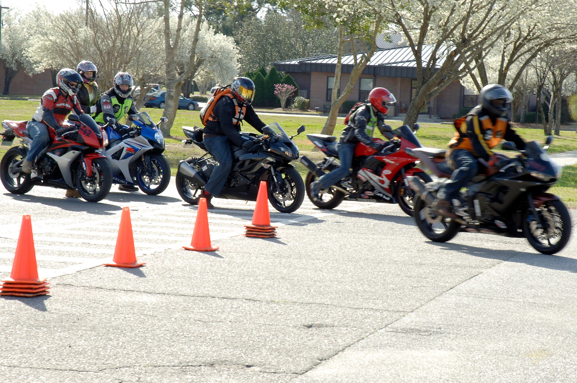 Sports bike riders take off from the base theater after attending an annual mandatory motorcycle riding briefing, which kicked off Air Mobility Command?s Spring Safety Focus March 19, 2010. More than 200 motorcycle riders from Joint Base Charleston showed up for the mandatory briefing and had the opportunity to participate in a Motorcycle Mentoring ride to Naval Weapons Station Short Stay. (U.S. Air Force photo/Staff Sgt. Marie Brown)
