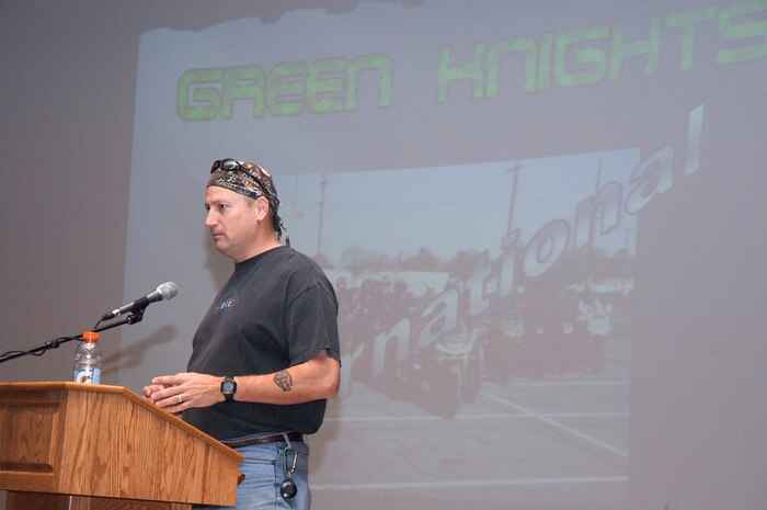 Master Sgt. Robert Carman talks about the Green Knights during an annual mandatory motorcycle riders meeting at the base theater, which kicked off Air Mobility Command?s Spring Safety Focus March 19, 2010. The Green Knights is military motorcycle organization geared toward mentoring, which Joint Base Charleston is trying to get started locally. Sergeant Carman is assigned to the 437th Maintenance Squadron. (U.S. Air Force photo/Staff Sgt. Marie Brown)