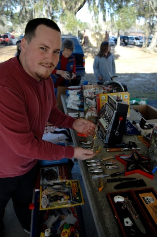 Leif Luffman showcases an authentic Italian-crafted knife at a base-wide yard sale and arts and crafts festival March 20, 2010, at Joint Base Charleston, S.C. There were 37 total participants at both the yard sale and festival selling goods. Mr. Luffman is an Air Force security forces veteran from the Charleston area. (U.S. Air Force photo/Senior Airman Timothy Taylor)
