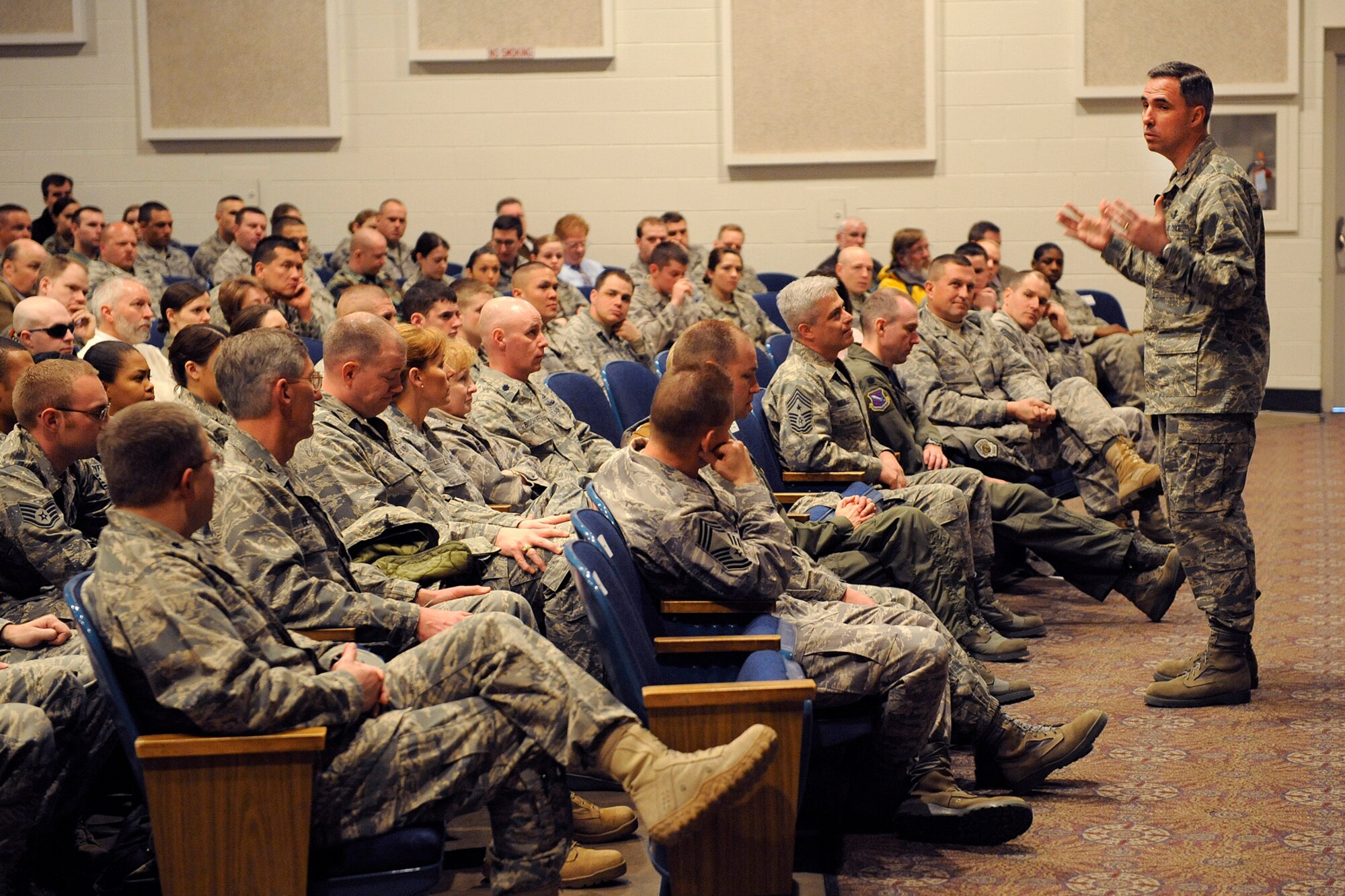 Col. Stephen N. Whiting, 21st Space Wing commander, addresses the troops March 9, during a commander’s call. Colonel Whiting spoke to Airmen about the importance of compliance and improvement. He emphasized the wing’s vision, to be America’s space superiority wing – globally postured to win, and he encouraged Airmen to be candid in self assessments for continued improvement. (U.S. Air Force photo/Craig Denton)  