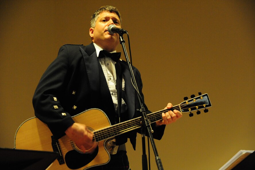 COLUMBIA, S.C. -- Technical Sgt. Paul Mezzanotte, a member of the Heritage Aire Celtic Ensemble, plays guitar during a performance for the Columbia community at the Columbia Museum of Art Mar. 21. Heritage Aire celebrates America's great cultural diversity by performing concerts in communities and schools throughout a six-state region. (U.S. Air Force photo/Airman 1st Class Neil D. Warner)