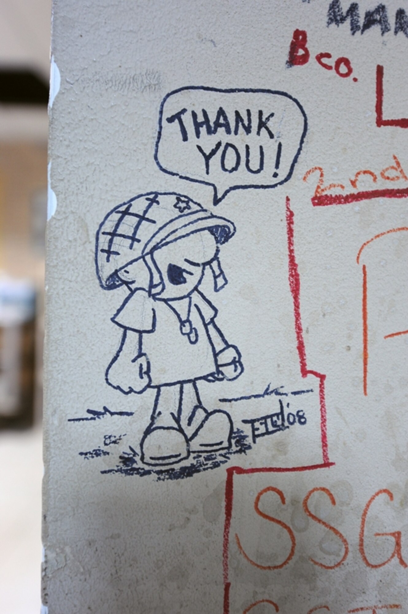 Names and messages are scribbled on the wounded warrior wall at the contingency aeromedical staging facility here. (U.S. Air Force photo/Master Sgt. Linda C. Miller/Released)