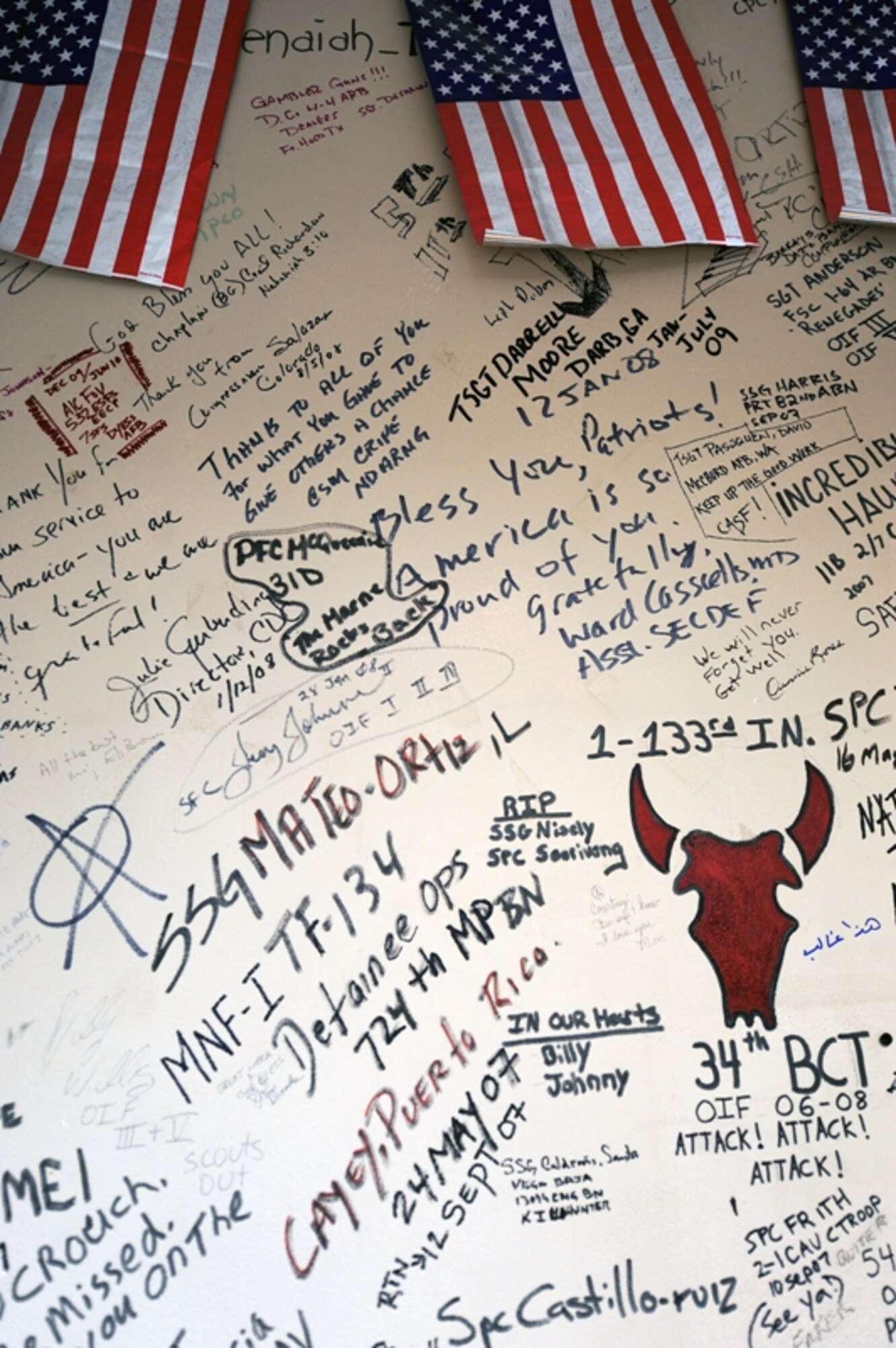 Names and messages are scribbled on the wounded warrior wall at the contingency aeromedical staging facility here. (U.S. Air Force photo/Master Sgt. Linda C. Miller/Released)