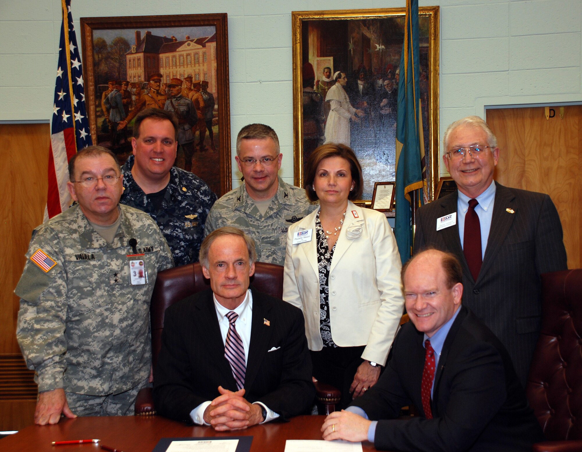 U.S. Senator for Delaware Tom Carper (sitting center) signed the Employer Support of the Guard and Reserve's Statement of Support for the Guard and Reserve March 19 in Wilmington, Del. On hand to witness the event was Maj. Gen. Francis Vavala, Delaware's Adjutant General, and Col. Randal L. Bright, the commander of the 512th Airlift Wing. (U.S. Air Force photo)