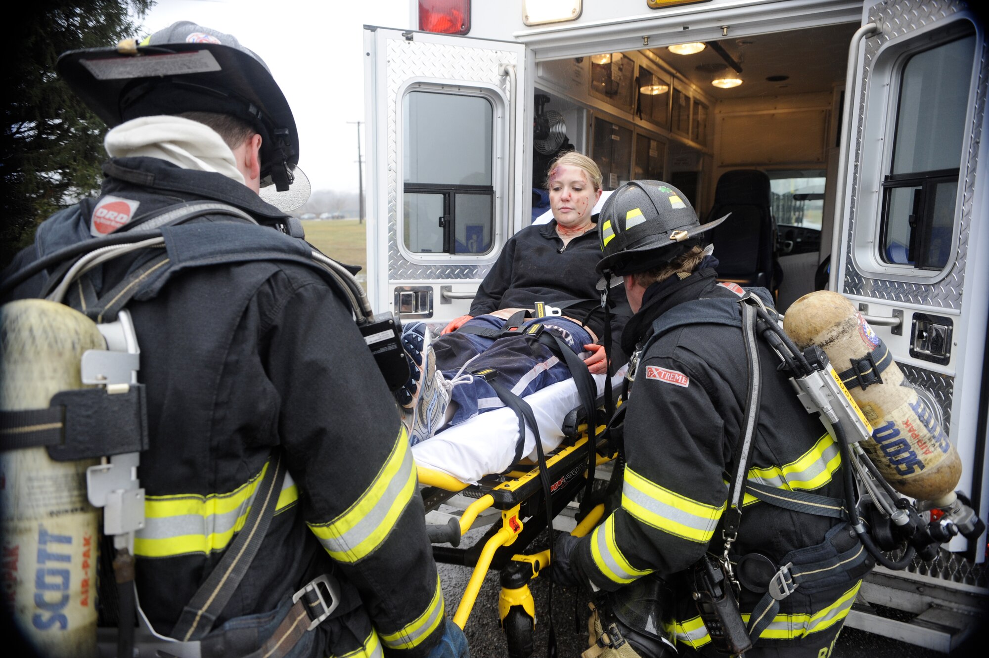 Emergency first responders help a mock victim into an ambulance during a HAZMAT Crisis Exercise March 15 at Joint Base McGuire-Dix-Lakehurst. The exercise is designed to evaluate and improve effective response times and communication among different emergency responders. (U.S. Air Force photo/Carlos Cintron)

