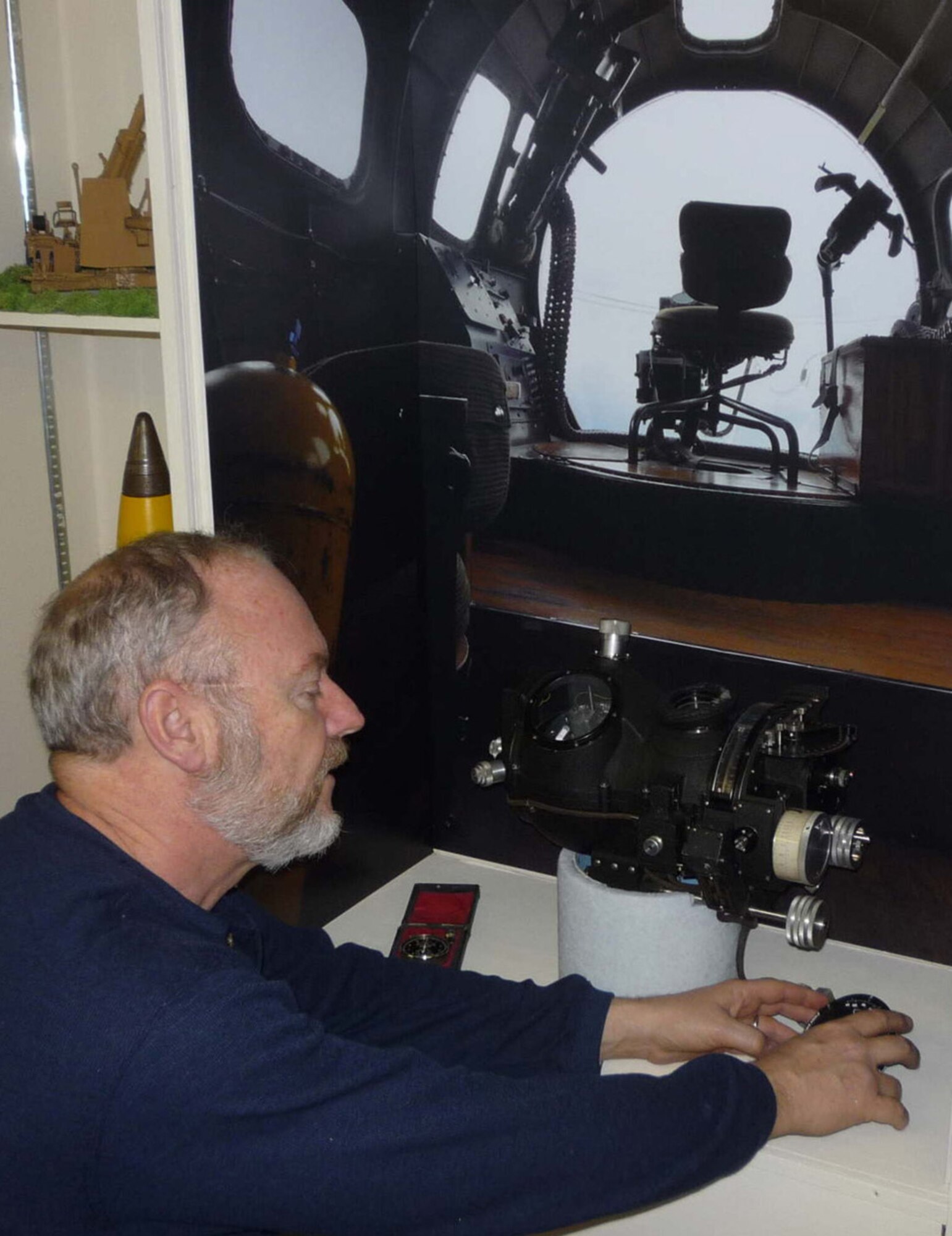 Tom Gill, a Tower Museum volunteer, applies the finishing touches to the new Norden Bombsight display. The museum at Bassingbourn celebrates the legacy of the U.S. Army Air Forces and Royal Air Force operations at one of Eighth Air Force's most famous installations. (Courtesy photo)