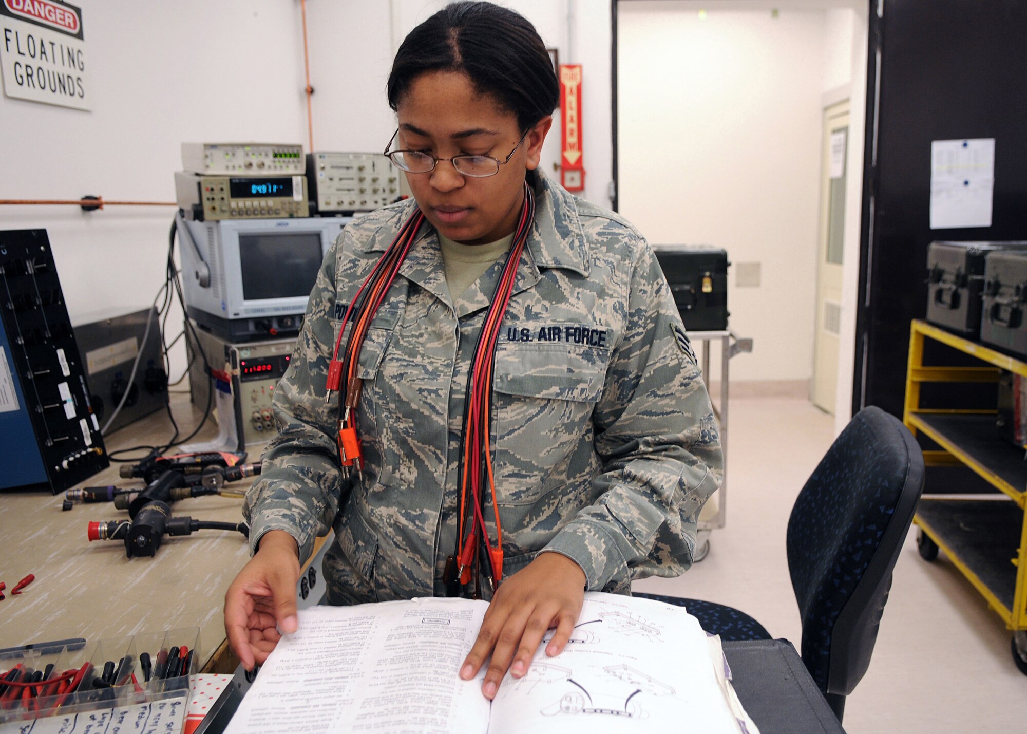 Senior Airman Candace Powell, 31st Maintenance Squadron, an equipments technician reads the instruction of a technical order book to conduct systems checks on wiring equipment. Airman Powell works as a test, measurement and diagnostic equipment technician in the Precision Measurement Equipment Laboratory.(U.S. Air Force photo/Senior Airman Taylor L. Marr)
