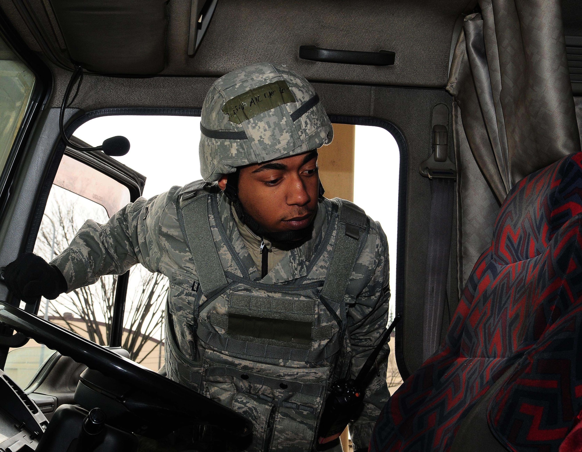 YOKOTA AIR BASE, Japan -- Airman 1st Class Clee Lee, 374th Security Forces Squadron Patrolman, inspects the inside of a cargo truck during a routine security check March 23. Security Forces Airmen conduct routine checks on cargo vehicles for suspicious materials. (U.S. Air Force photo/Airman 1st Class Lynsie Lorenz)