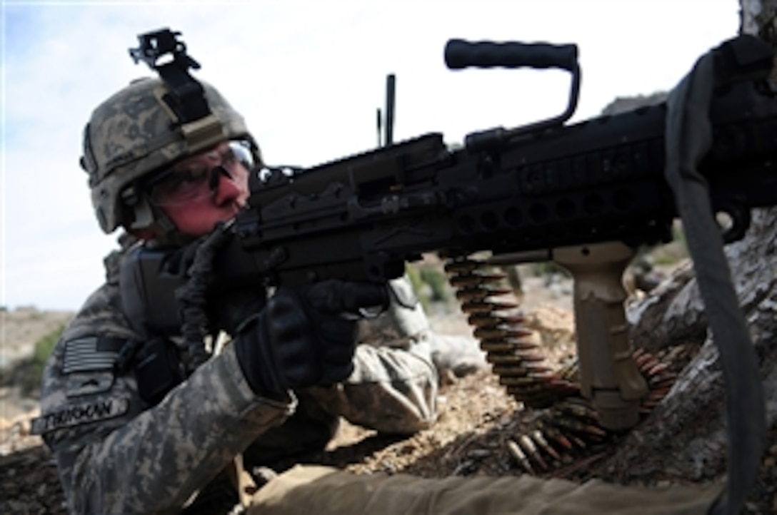U.S. Army Sgt. Joshua Thurman, with Alpha Troop, 1st Squadron, 33rd Cavalry Regiment, 3rd Brigade Combat Team, 101st Airborne Division, provides security while on patrol in Spera, Khost province, Afghanistan, on March 11, 2010.  