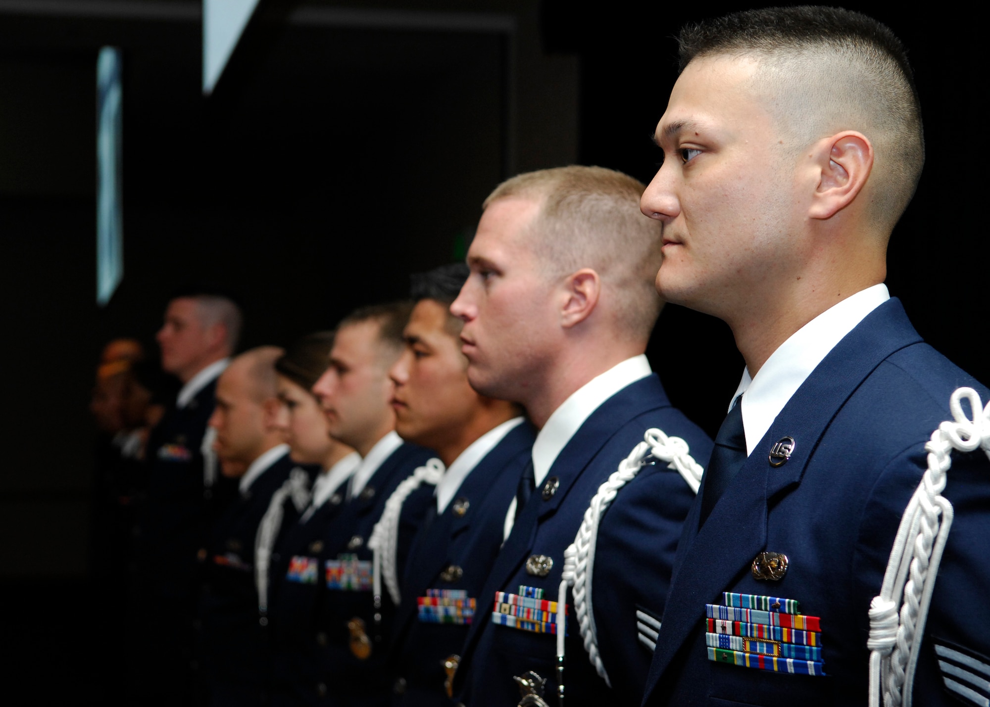 VANDENBERG AIR FORCE BASE, Calif. -- Adorning their white aiguillettes, the 15 newest Airman Leadership School graduates await congratulatory handshakes from the audience during graduation here Tuesday, March 23, 2010. ALS is a class aimed at providing the newest soon-to-be noncommissioned officers with leadership training. (U.S. Air Force photo/Senior Airman Heather R. Shaw)
