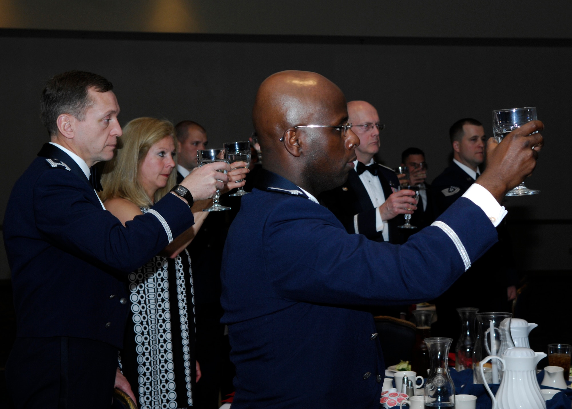 VANDENBERG AIR FORCE BASE, Calif. -- Taking a moment to recognize servicemembers who were, are or will be prisoners of war or missing in action, attendees of the Airman Leadership School graduation raise their glasses here Tuesday, March 23, 2010. Raising the glass honors America's POW/MIA. (U.S. Air Force photo/Senior Airman Heather R. Shaw)

