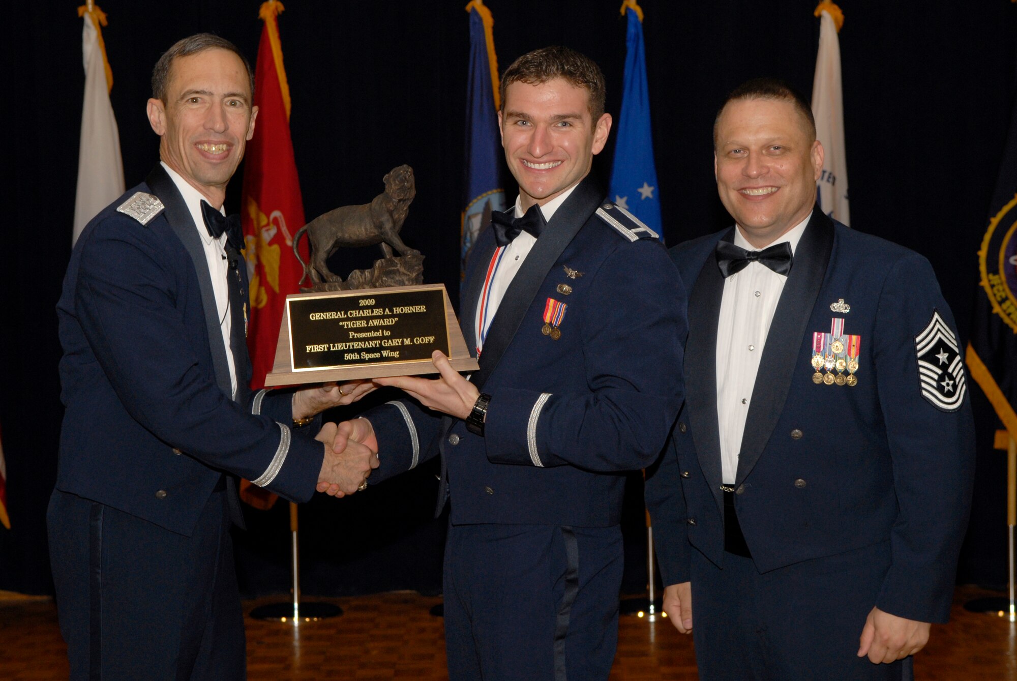 VANDENBERG AIR FORCE BASE, Calif. -- First Lieutenant Gary Goff, with the 3rd Space Operations Squadron at Schriever Air Force Base, Colo., receives the Officer Tiger Award from Lt. Gen. Larry James, the 14th Air Force commander, and Chief Master Sgt. James MacKinley, the 14th AF command chief master sergeant, during the 14th Air Force Annual Awards Ceremony at the Pacific Coast Club here Thursday, March 18, 2010.   (U.S. Air Force photo/Senior Airman Andrew Satran) 

 

 

 

 

 

 

 

 

 

 

 

 
 
