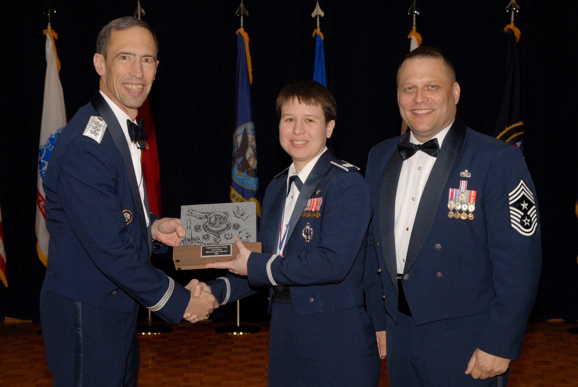 VANDENBERG AIR FORCE BASE, Calif. -- Capt. Barbara King, from the 2nd Range Operations Squadron, receives the 14th Air Force Flight Commander of the Year Annual Award from Lt. Gen. Larry James, the 14th Air Force commander, and Chief Master Sgt. James MacKinley, the 14th AF command chief master sergeant, during the 14th Air Force Annual Awards Ceremony at the Pacific Coast Club here Thursday, March 18, 2010.   (U.S. Air Force photo/Senior Airman Andrew Satran) 

 

 

 

 

 

 

 

 

 

 
 