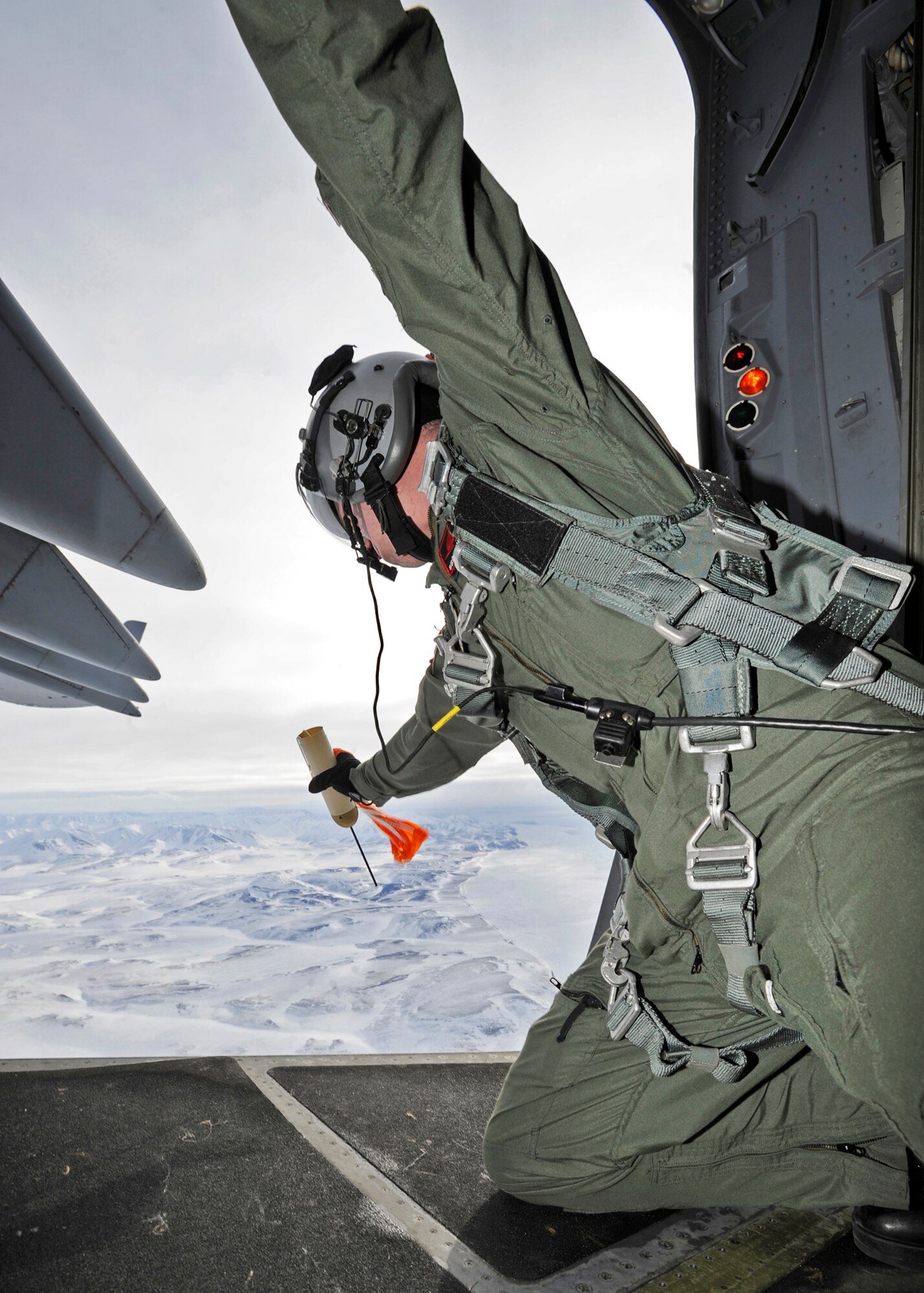 ELMENDORF AIR FORCE BASE, Alaska -- Staff Sgt. Chris McKnight prepares to deploy a sonde transmitter March 19. Sergeant McKnight and his crew from the 517th Airlift Squadron were participating in a combat simulation improved container delivery drop over Tin City, Alaska. (Air Force photo by Senior Airman Matt Coleman-Foster)