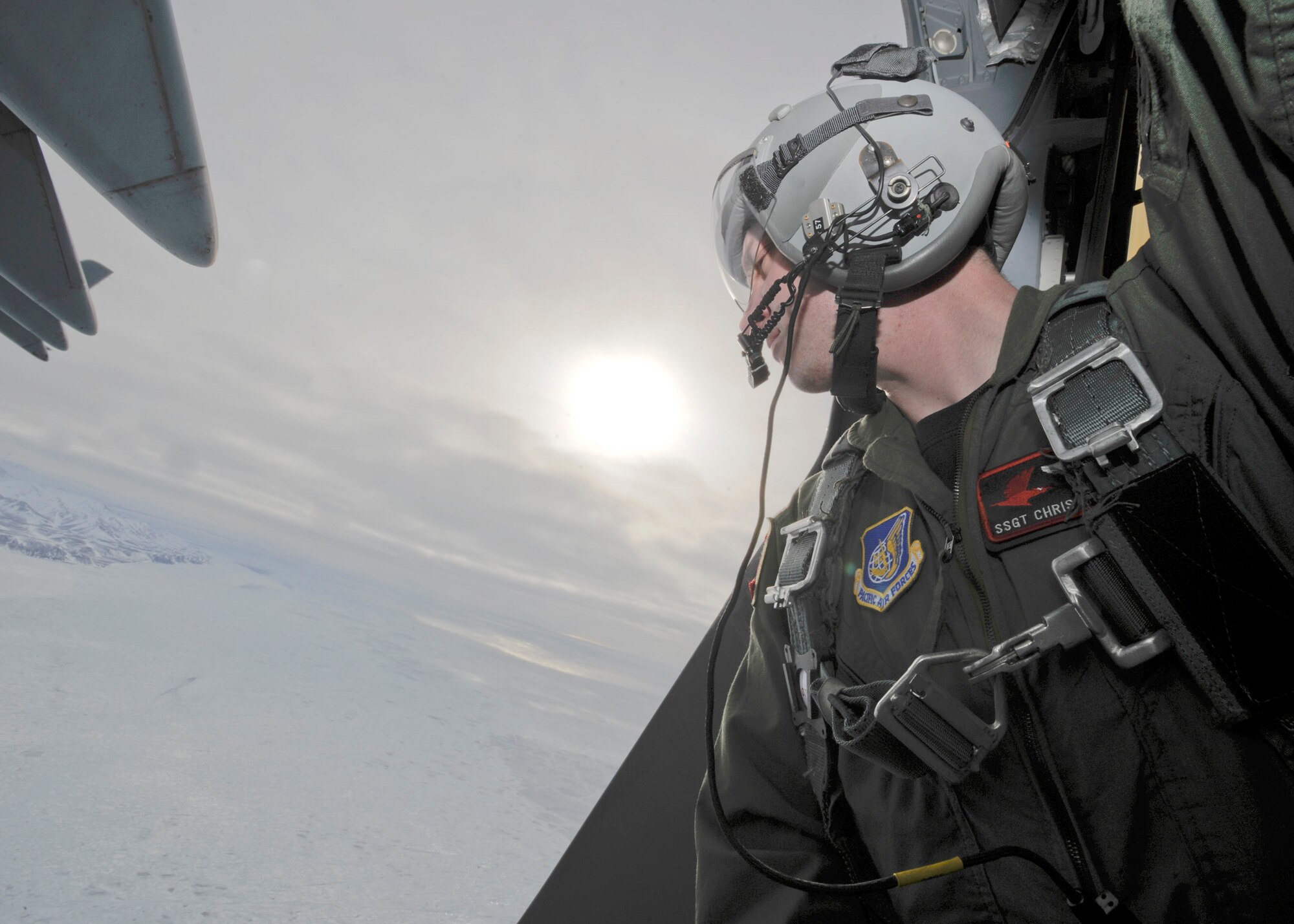 ELMENDORF AIR FORCE BASE, Alaska -- Staff Sgt. Chris McKnight checks his drop zone before deploying a sonde transmitter March 19. Sergeant McKnight and his crew from the 517th Airlift Squadron were participating in a combat simulation improved container delivery drop over Tin City, Alaska. (Air Force photo by Senior Airman Matt Coleman-Foster)