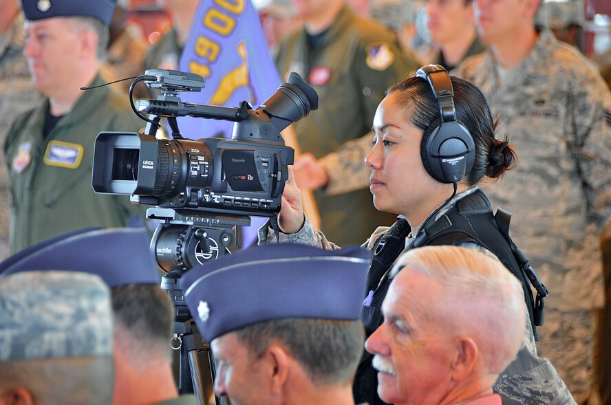 HOLLOMAN AIR FORCE BASE, N.M. -- Tech. Sgt. Lisa Carlson, 49th Fighter Wing Public Affairs broadcaster, documents an assumption of command ceremony Oct. 23, 2009. Sergeant Carlson recently took first place in the radio spot production and radio feature report categories for the 2009 Air Combat Command Media Contest. (U.S. Air Force photo by Tech. Sgt. Chris Flahive) 