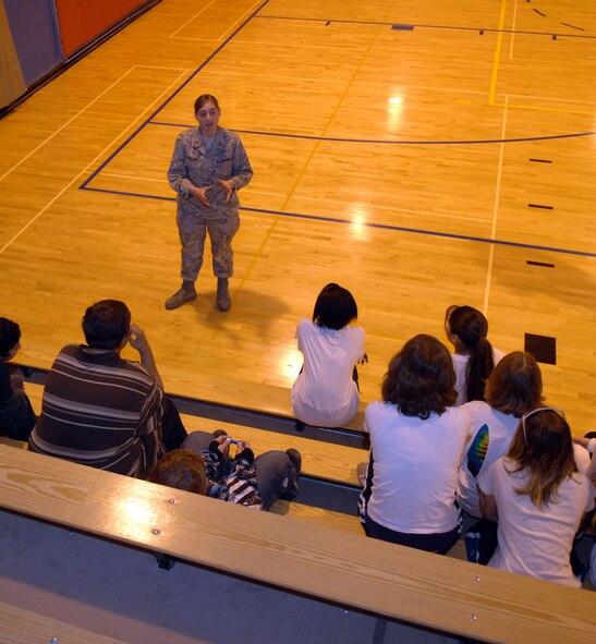 HOLLOMAN AIR FORCE BASE, N.M. -- (Then) 2nd Lt. Michele Rollins, 49th Fighter Wing Public Affairs deputy director, speaks to children at the Holloman Middle School, Feb. 19, 2009. Lieutenant Rollins, now a first lieutenant, recently placed first in the Outstanding Public Affairs Company Grade Officer for the 2009 Air Force Public Affairs Awards for Communication Excellence. (U.S. Air Force photo by Airman 1st Class Veronica Stamps)