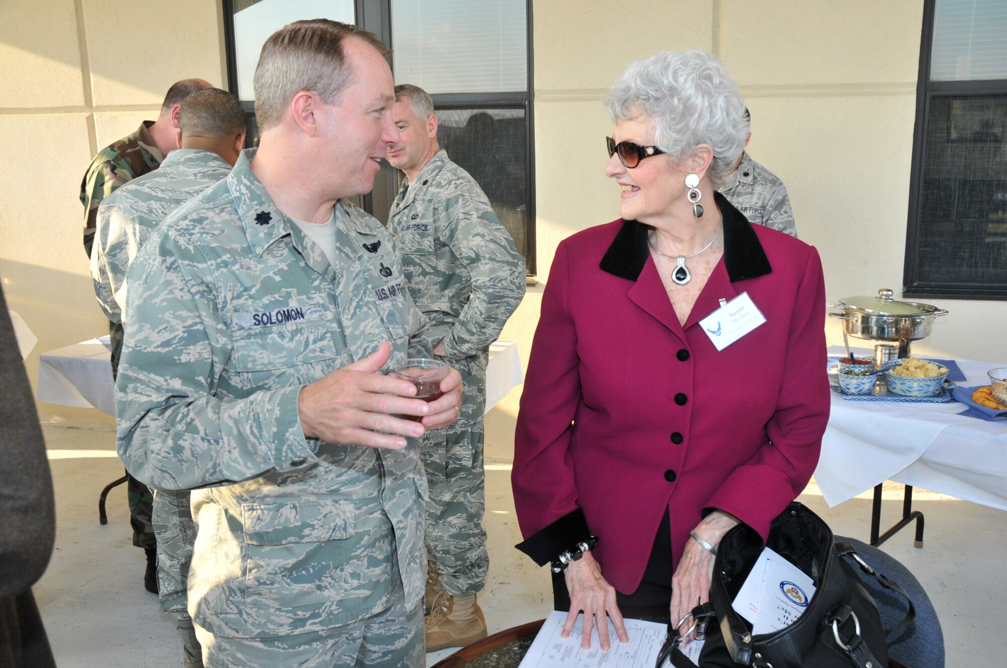 Lt. Col. Scott Solomon, 333th Training Squadron commander, and Susan Hunt, Biloxi School District,  get acquainted at the 81st Training Group parade March 18.   Ms. Hunt is among local civic leaders selected as Keesler’s honorary commanders.  The program is intended to foster the supportive relationship between the base and the community, increase military involvement in civic endeavors and organizations and recognize the members of the local community as part of the Keesler family.  A reception was co-hosted by the 81st Training Wing and the John C. Stennis Chapter of the Air Force Association.    (U.S. Air Force photo by Adam Bond)

