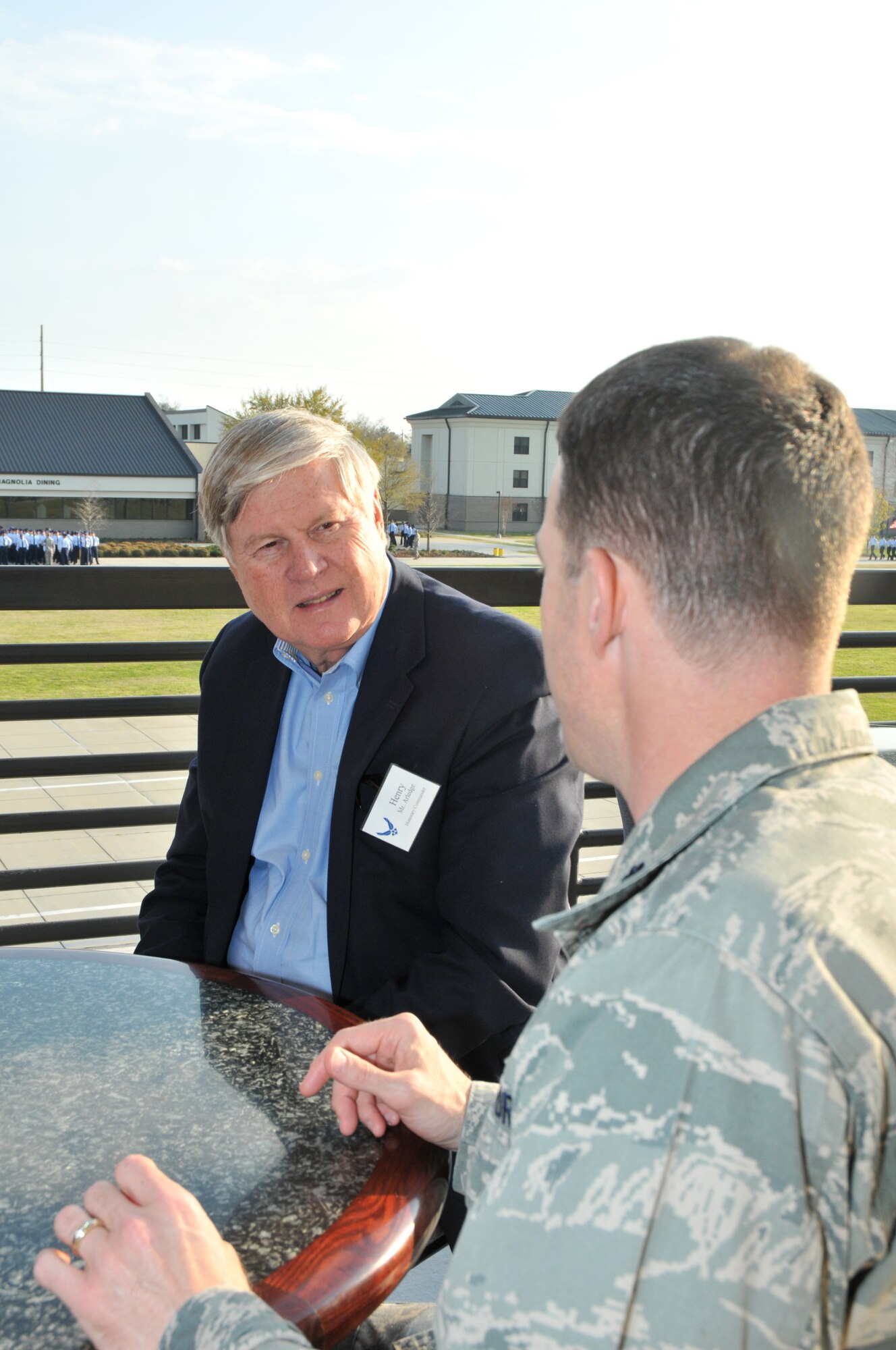 Henry Arledge, superintendent of the Harrison County School District, and Lt. Col. Brad Hamant, 332nd TRS commander, get acquainted at the 81st Training Group parade March 18.  Mr. Arledge is among local civic leaders selected as Keesler’s honorary commanders.  The program is intended to foster the supportive relationship between the base and the community, increase military involvement in civic endeavors and organizations and recognize the members of the local community as part of the Keesler family.  A reception was co-hosted by the 81st Training Wing and the John C. Stennis Chapter of the Air Force Association.   (U.S. Air Force photo by Adam Bond)
