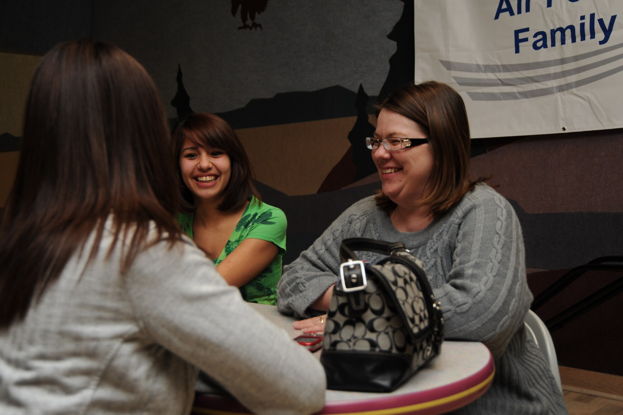 MOUNTAIN HOME AIR FORCE BASE, Idaho -- Maureen Elam, (right) ESC president, Jessica Cahal, (center), talk with another member of the ESC during the club’s social hour at the base bowling center. The ESC is a non-profit organization that promotes the general welfare of the Mountain Home AFB community throughout the year. The ESC meets the first Tuesday of the month from 6:30 to 7:30 p.m. at the chapel annex and ends the night with a social hour. (U.S. Air Force photo by 1st Lt. Neil Samson)