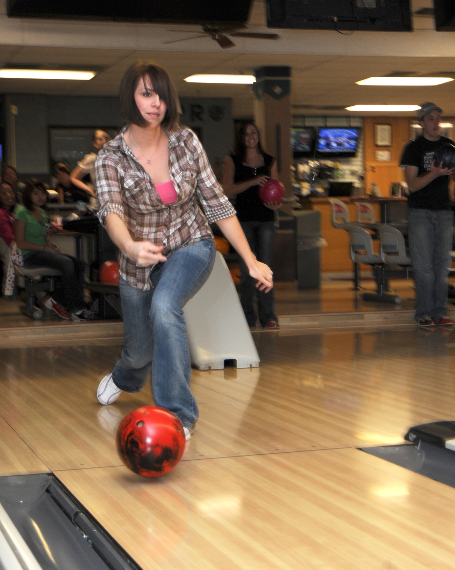 MOUNTAIN HOME AIR FORCE BASE, Idaho -- Alisa Ittner, Mountain Home AFB Enlisted Spouses’ Club vice president bowls at the base bowling center during the club’s social hour. The ESC is a non-profit organization that promotes the general welfare of the Mountain Home AFB community throughout the year. The ESC meets the first Tuesday of the month from 6:30 to 7:30 p.m. at the chapel annex and ends the night with a social hour. (U.S. Air Force photo by Airman 1st Class Renishia Richardson)