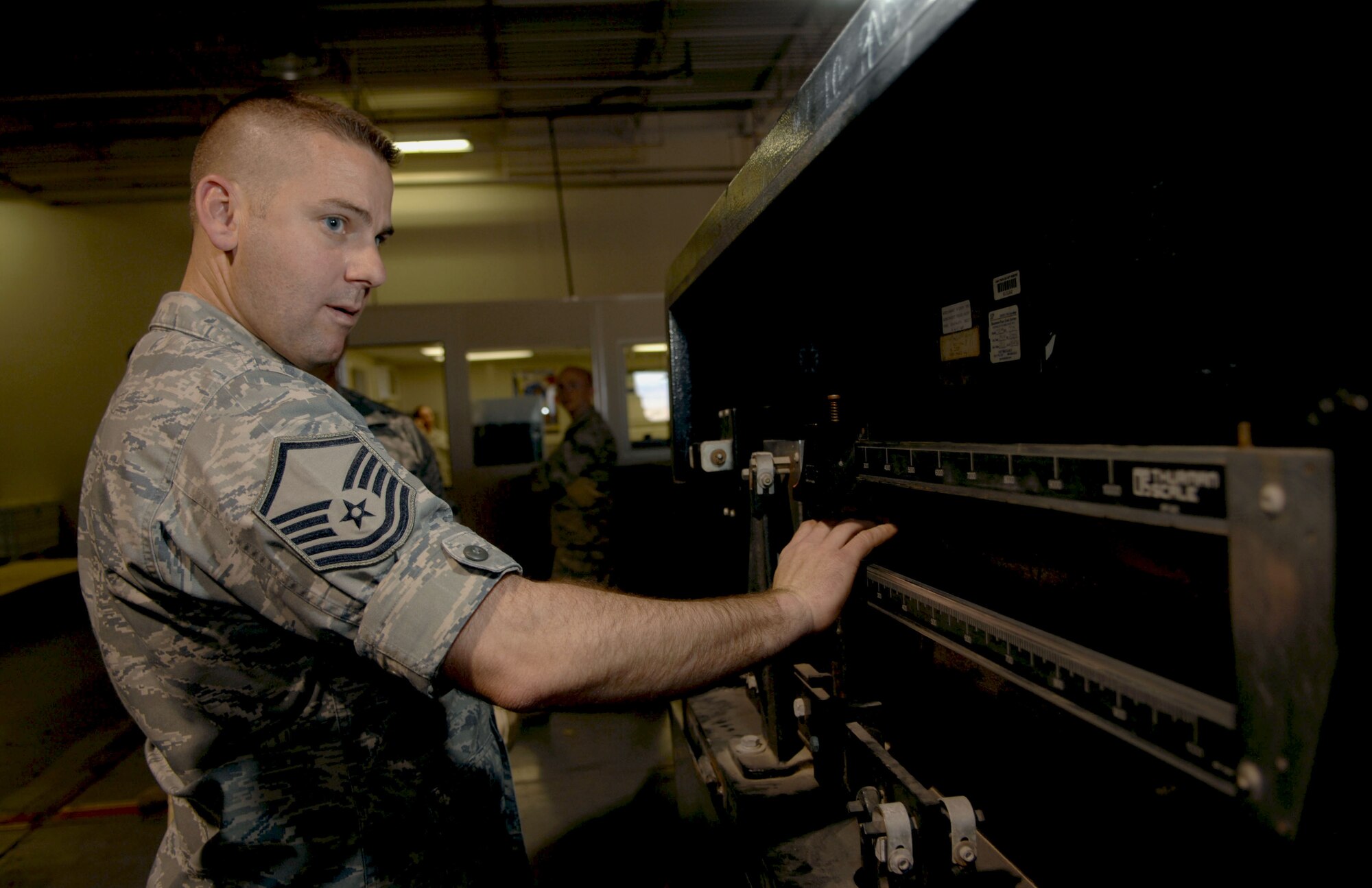 HOLLOMAN AIR FORCE BASE, N.M. -- Master Sgt. Daniel Keene, 49th Logistics Readiness Squadron vehicle fleet manager, weighs a relief package, March 17, 2010, that was delivered to Chile. The relief package consisted of more than 5,000 pounds of tools and supplies to assist in the relief operations in Chile. The South American nation was hit by an 8.8 magnitude earthquake Feb. 27, 2010. (U.S. Air Force photo by Airman 1st Class Joshua Turner)(Released)