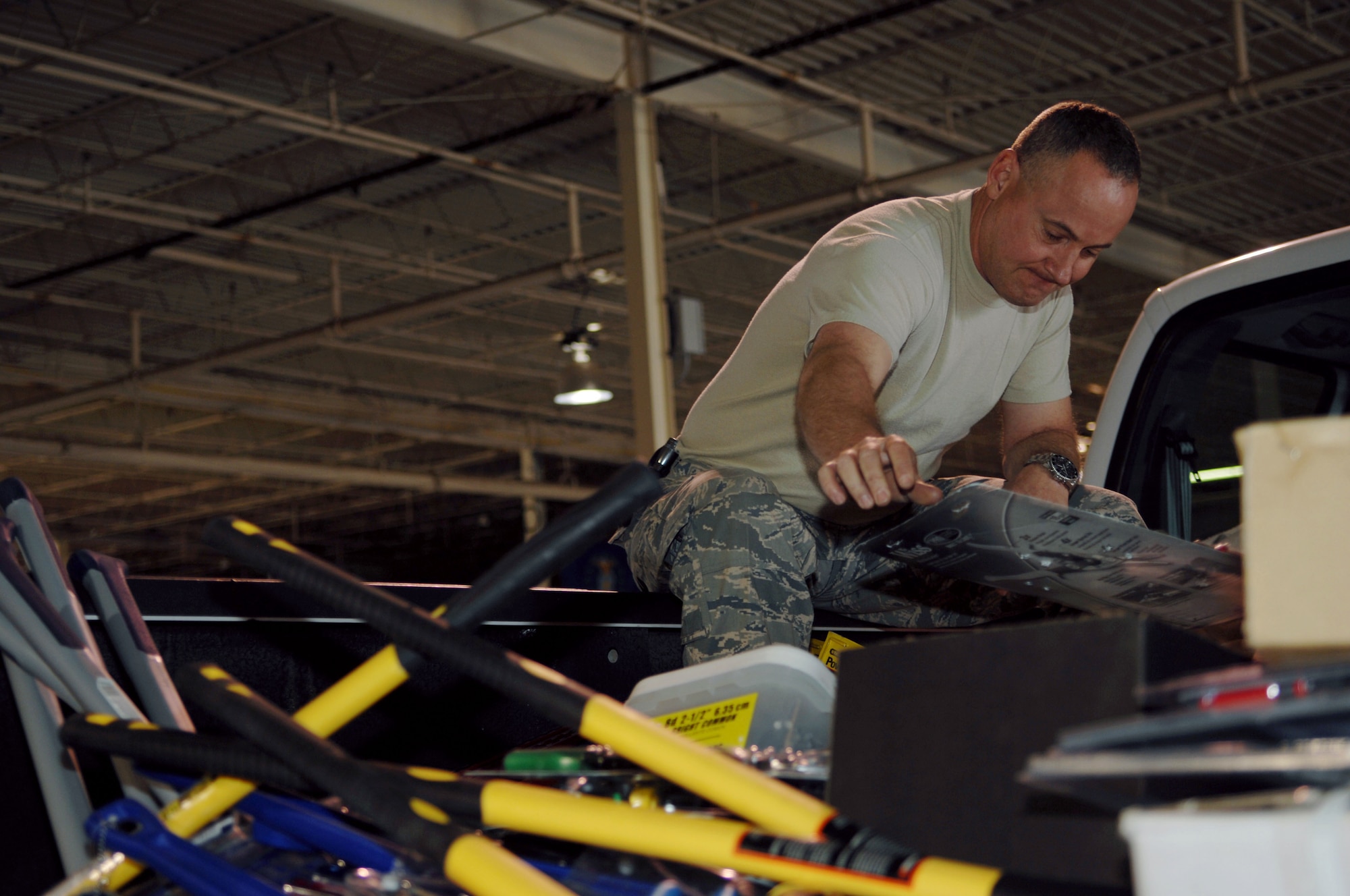 HOLLOMAN AIR FORCE BASE, N.M. -- Master Sgt. Michael Means, 49th Civil Engineer Squadron heavy superintendent, arranges tools for a relief package, March 16, 2010, that was sent to Chile. More than $13,000 was spent in the local community at local hardware stores purchasing the equipment. (U.S. Air Force photo by Airman 1st Class Joshua Turner)(Released)