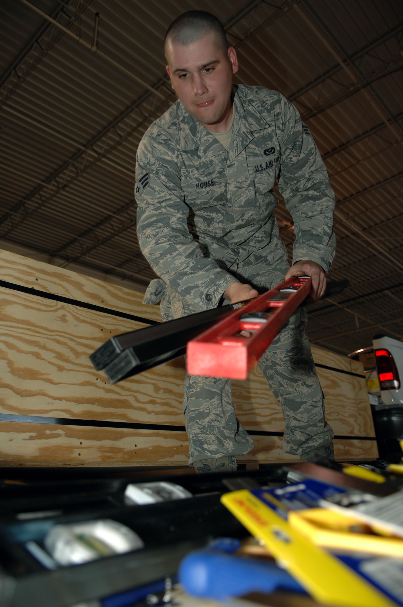 HOLLOMAN AIR FORCE BASE, N.M. -- Senior Airman Clinton House, 49th Civil Engineer Squadron, loads tools into a relief package March 17, 2010. The 49th CES put together a package of tools and supplies to assist in the relief operations in Chile following the 8.8 magnitude earthquake that hit the South American nation Feb. 27, 2010. (U.S. Air Force photo by Airman 1st Class Joshua Turner)(Released)