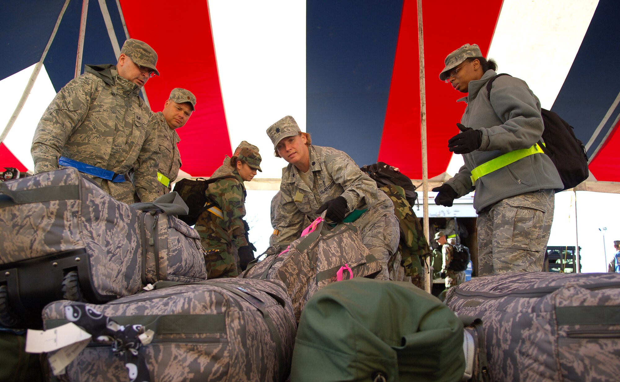 SCOTT AIR FORCE BASE, Ill. – 375th Medical Group personnel stack mobility bags onto a pallet that will be flown to their simulated deployed location during the initial stages of the Operational Readiness Inspection, March 23, 2010. The 375th Air Mobility Wing is being graded by the Air Mobility Command inspector general to ensure they are able to respond to a global threat and deploy combat ready Airmen at a moments notice. (U.S. Air Force photo by Senior Airman Ryan Crane)