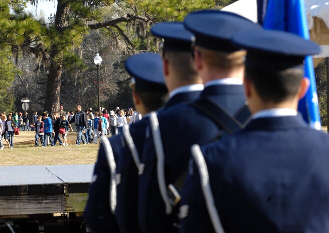 The base honor guard prepares to present the colors as students from eight tri-county area elementary schools file in to the picnic grounds for the 14th annual Earth Day festival on Joint Base Charleston, S.C., March 24, 2010. The event celebrates Earth day in conjunction with Arbor Day. Arbor Day is a holiday in which individuals and groups are encouraged to plant trees and care for the environment. Arbor Day originated in Nebraska City and is celebrated in a number of countries. (U.S. Air Force Photo/Airman 1st Class Lauren Main)
