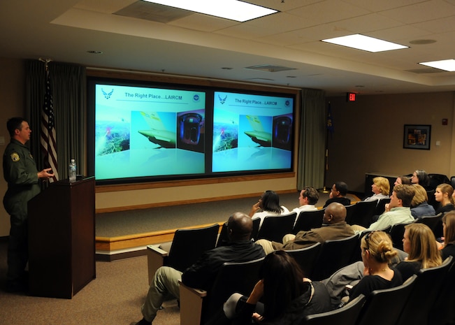 U.S. Air Force Lt. Col. Michael Carr gives a briefing at the 16th Airlift Squadron at Joint Base Charleston, S.C., March 18, 2010, during a base tour for nearly 50 members of the Leadership Charleston 2010 class. The colonel provided the class with personal insight from training and combat experience on what it takes to produce global reach and how the local Charleston community contributes to it every day. Colonel Carr is a pilot tactician with the 437th Airlift Wing Combat Operations and Tactics. (U.S. Air Force photo/Staff Sgt. Daniel Bowles)